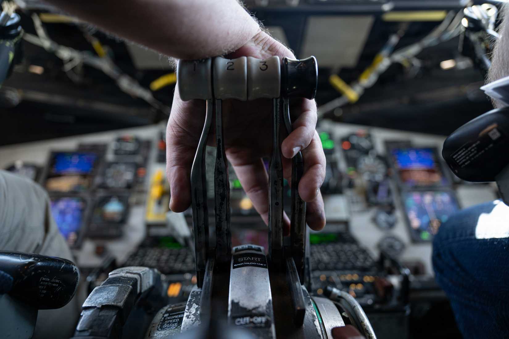 Air Force pilot grips the throttles on a U.S. Air Force KC-135 Stratotanker aircraft