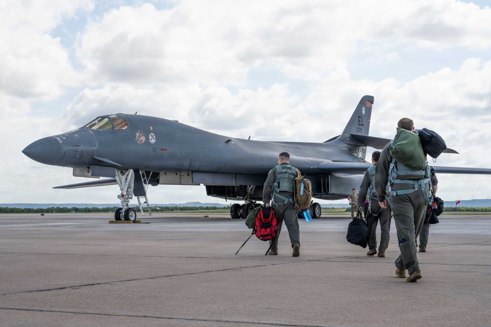 Air Force pilots assigned to the 28th Bomb Squadron conduct pre-flight checks in a B-1B Lancer