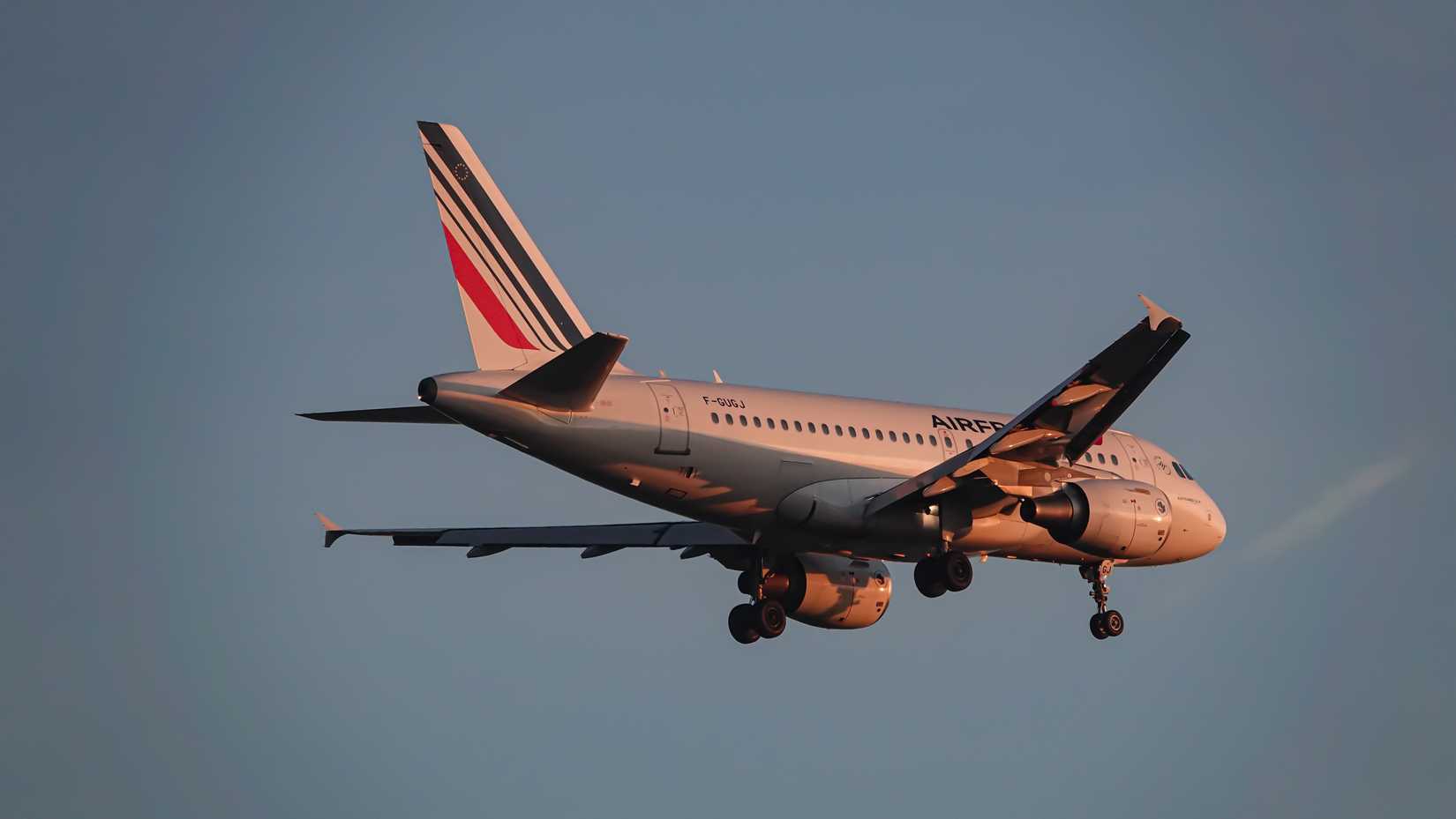 Air France Airbus A318-100 landing at in the sunset