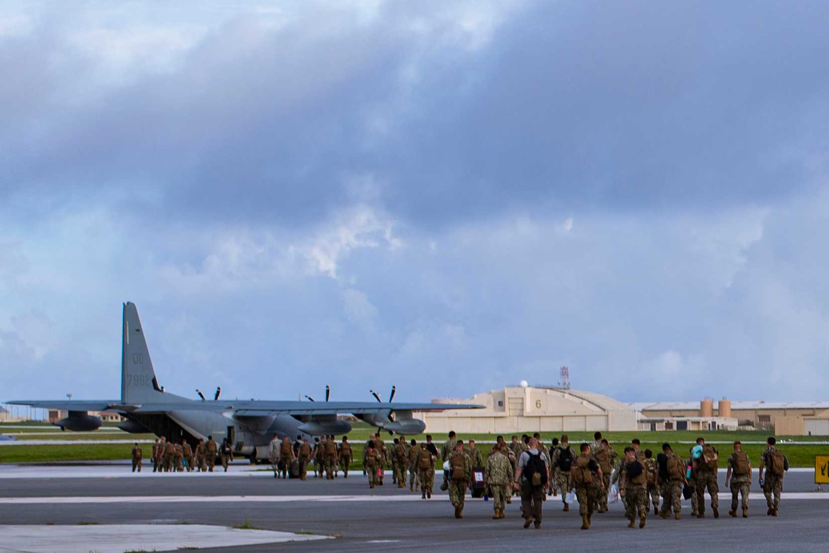 Airmen, Sailors and Marines board a KC-130J Hercules Aerial Refueling Tanker in preparation for Exercise Valiant Shield 18 at Andersen Air Force Base