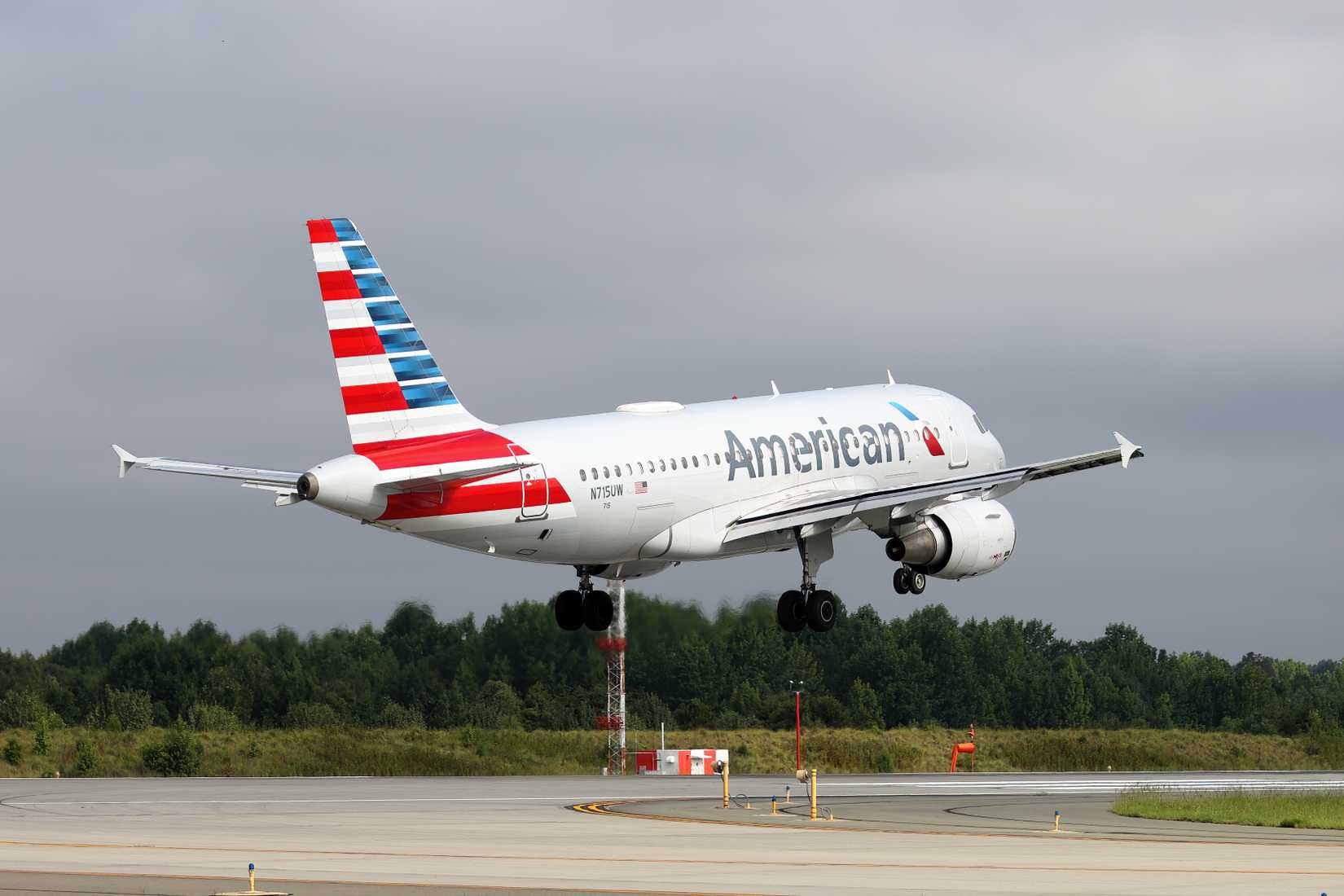 American Airlines A319 landing on runway, Charlotte Douglas International Airport
