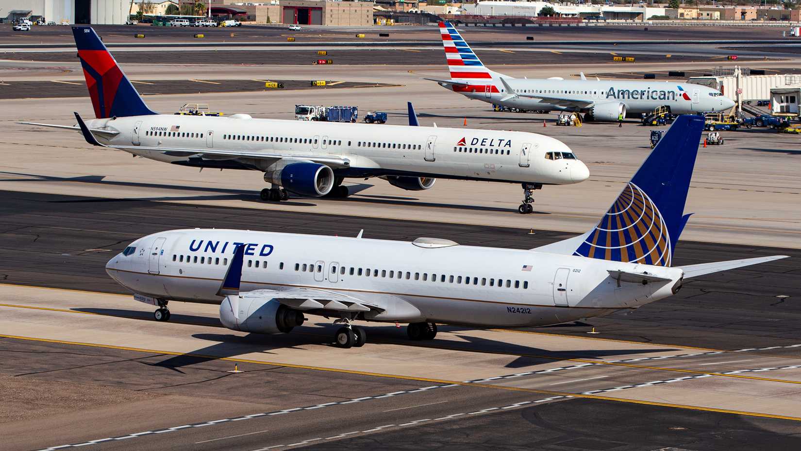 American, Delta and United aircraft on the ground