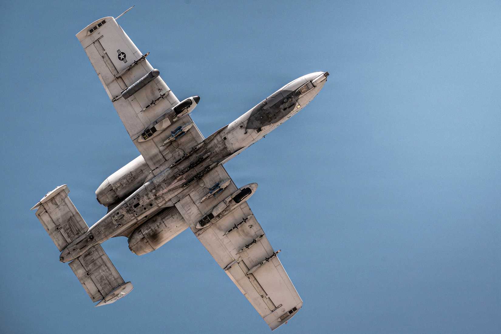 An A-10C Thunderbolt II passes overhead on its final flight over Davis-Monthan Air Force Base, Ariz., July 29, 2026