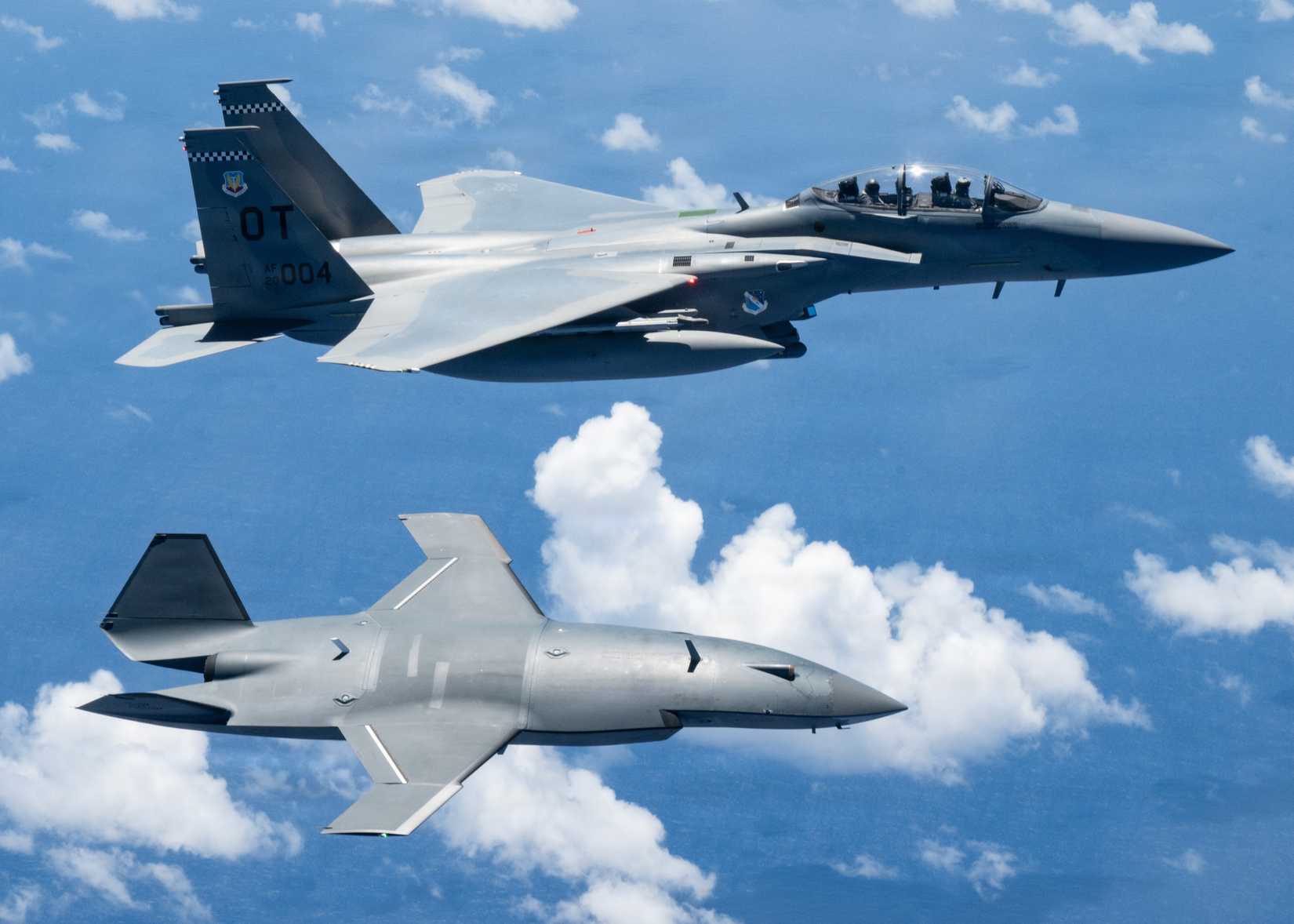 An MQ-28 Ghost Bat from Boeing Defense Australia and a U.S. Air Force F-15EX Eagle II, assigned to the 85th Test and Evaluation Squadron participate in Valiant Shield 2026 over the Philippine Sea