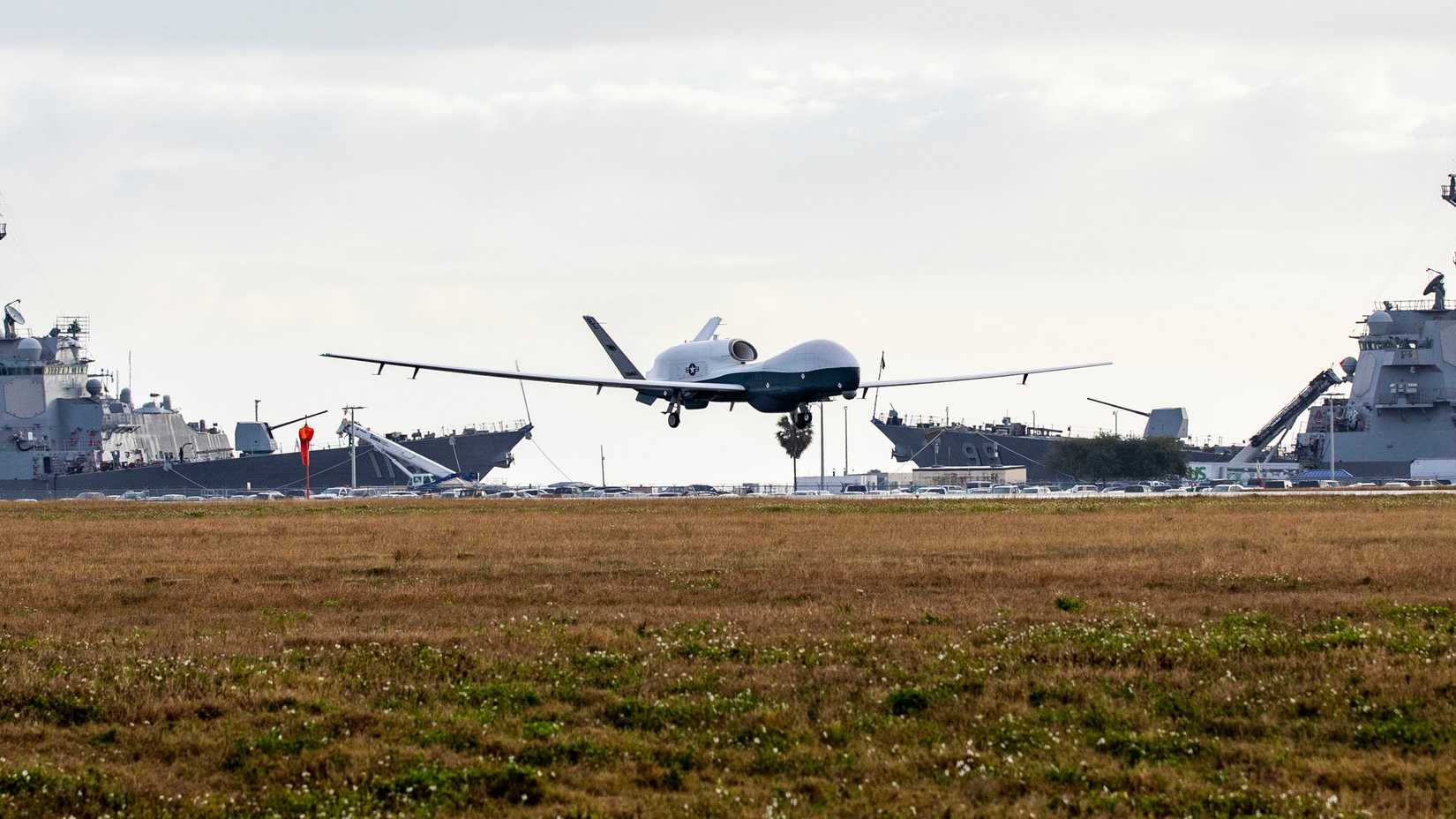 An MQ-4C Triton Unmanned Aircraft System (UAS), assigned to Unmanned Patrol Squadron 19 (VUP-19), lands at Naval Station Mayport, Florida