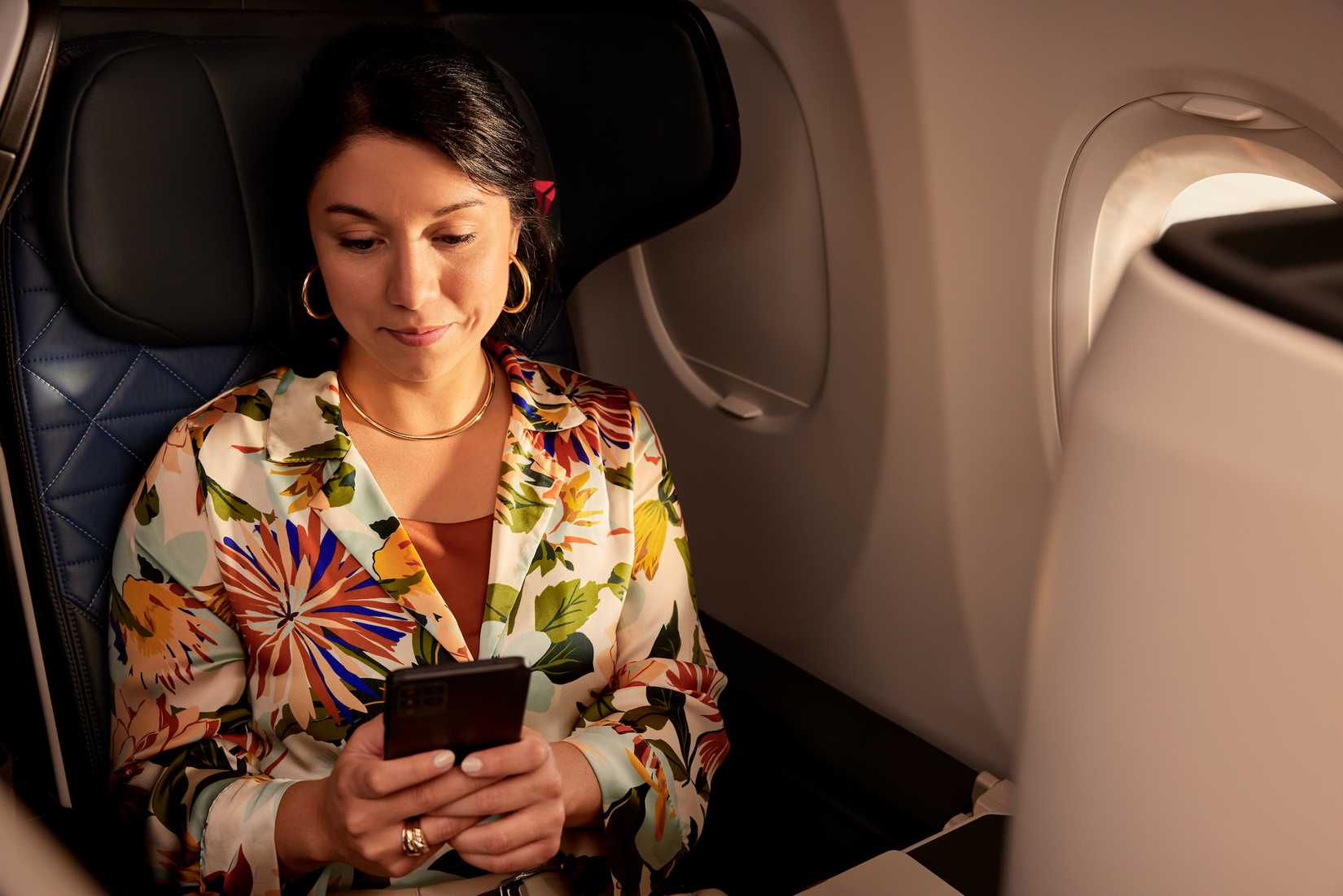 Delta Passenger Using Phone