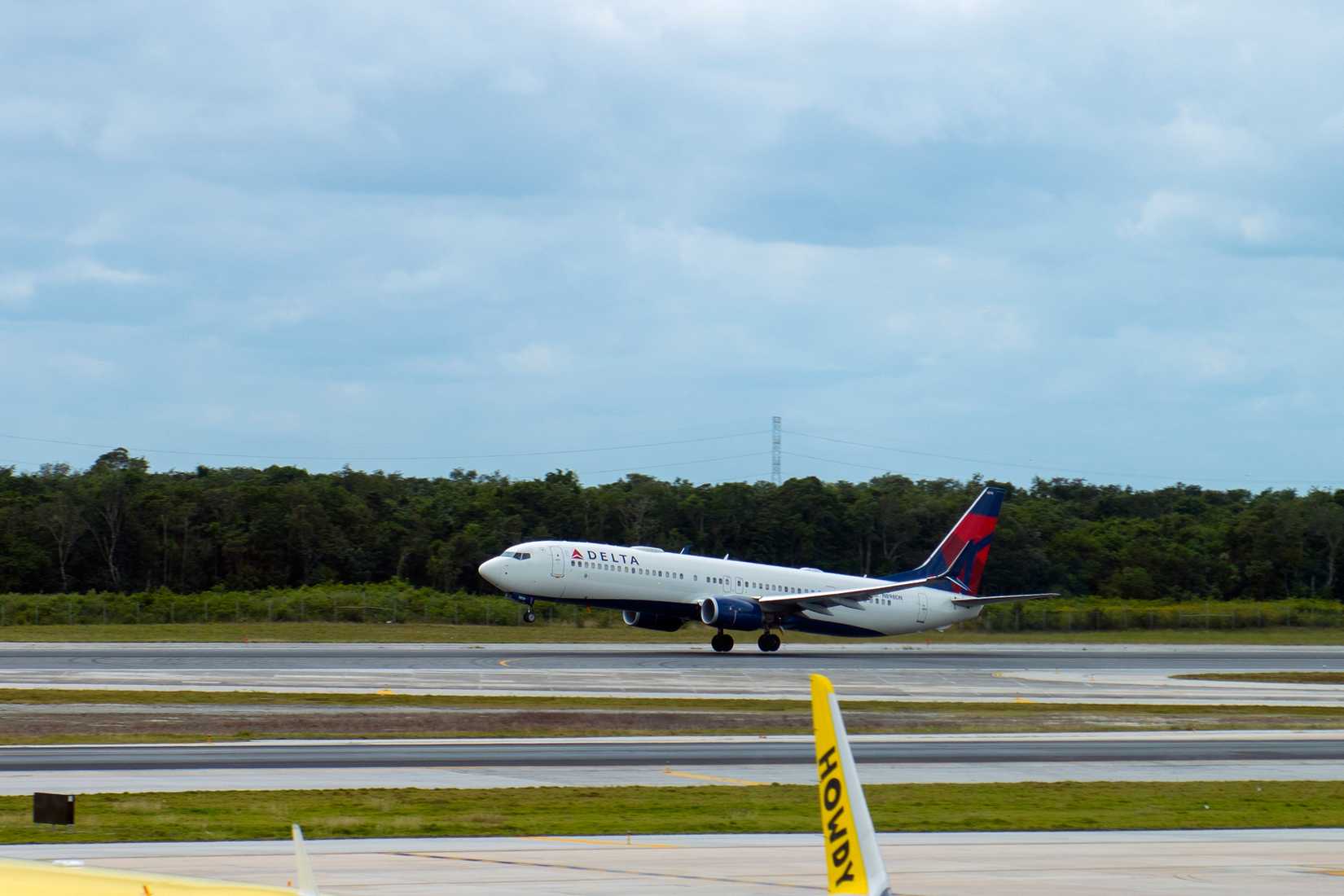 Delta Air Lines Boeing B737-900 taking off at Cancun International Airport