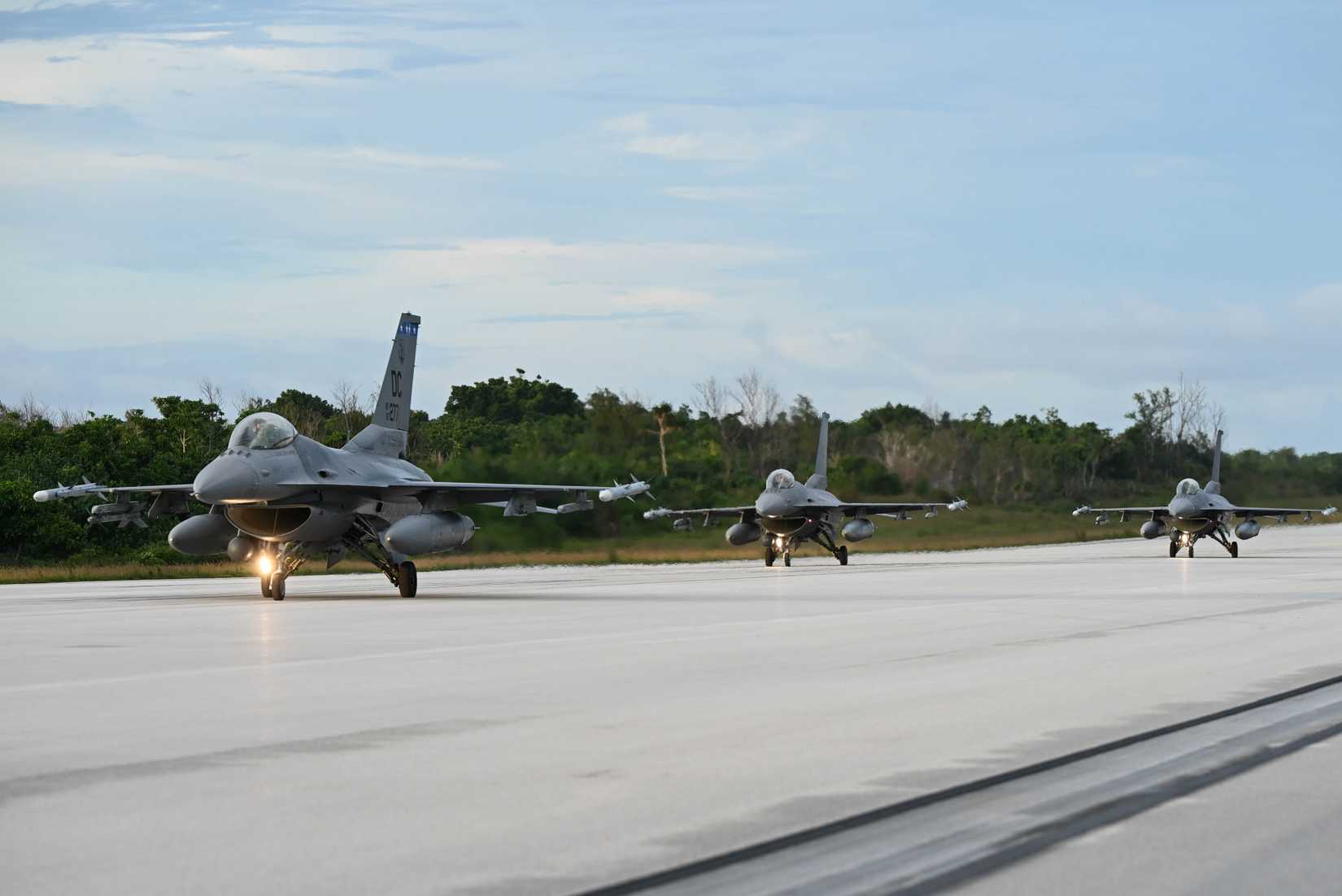 F-16 Fighting Falcons assigned to 121st Fighter Squadron, District of Columbia Air National Guard, taxi down the flightline on Northwest Field, Guam, July 17, 2025