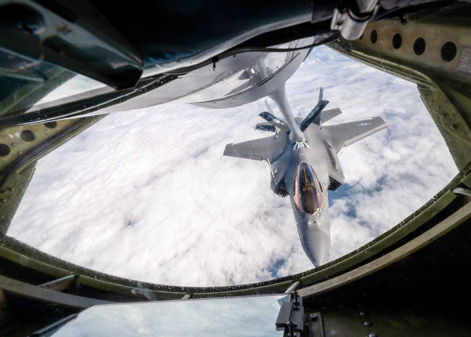 A photo of an F-35 refueling, as seen through the aft crew window, which oversees the operation. 