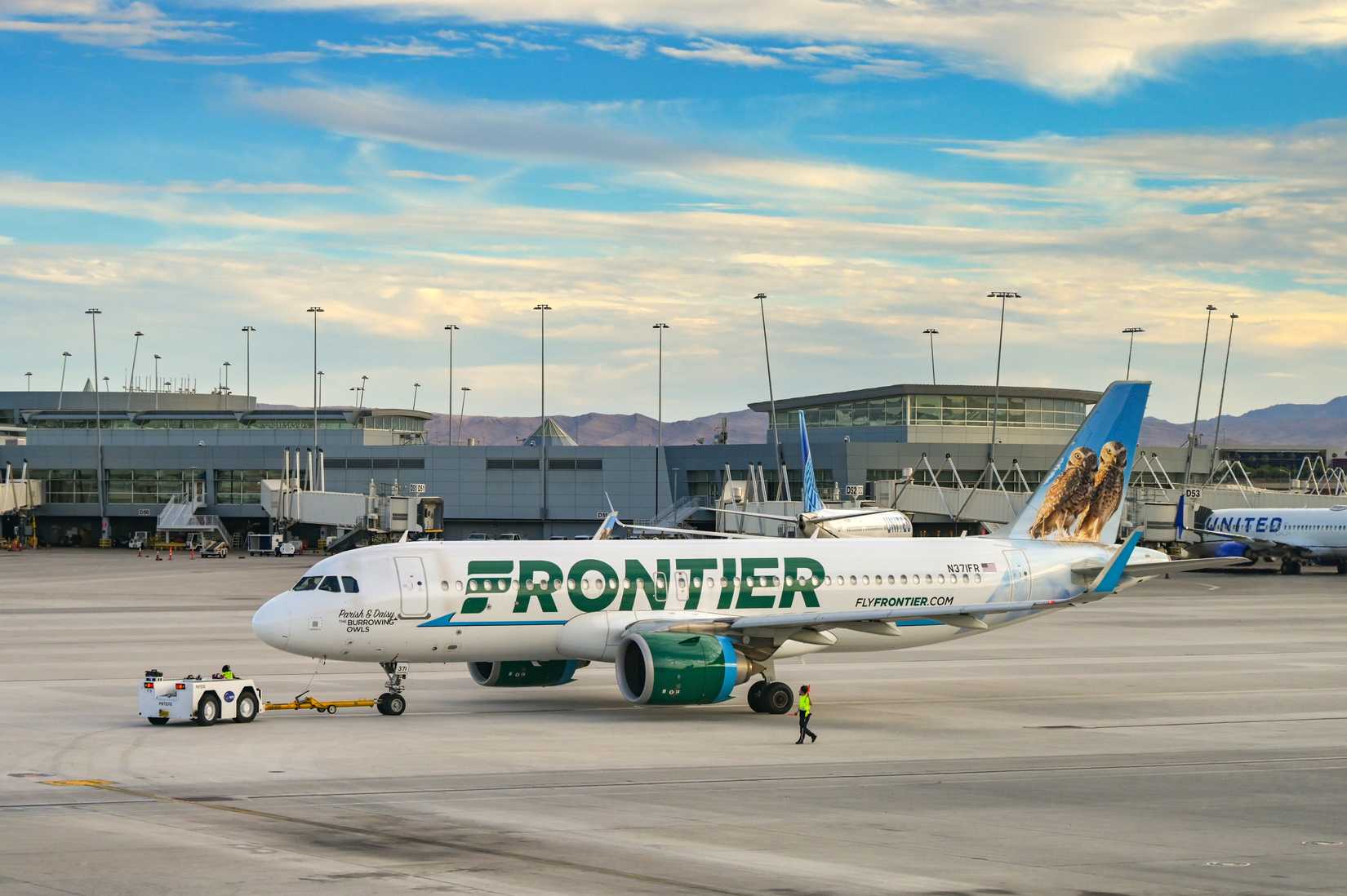Frontier Airlines Airbus A320 (registration N371FR) being pashed by for departure from Harry Reid International Airport