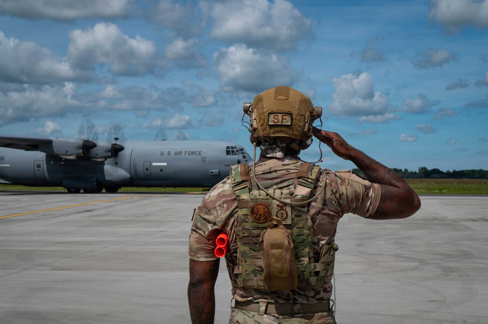 ir Force Tech. Sgt. Brenden Stevens, security forces, 172nd Airlift Wing, Mississippi National Guard, marshals a C-130J Super Hercules
