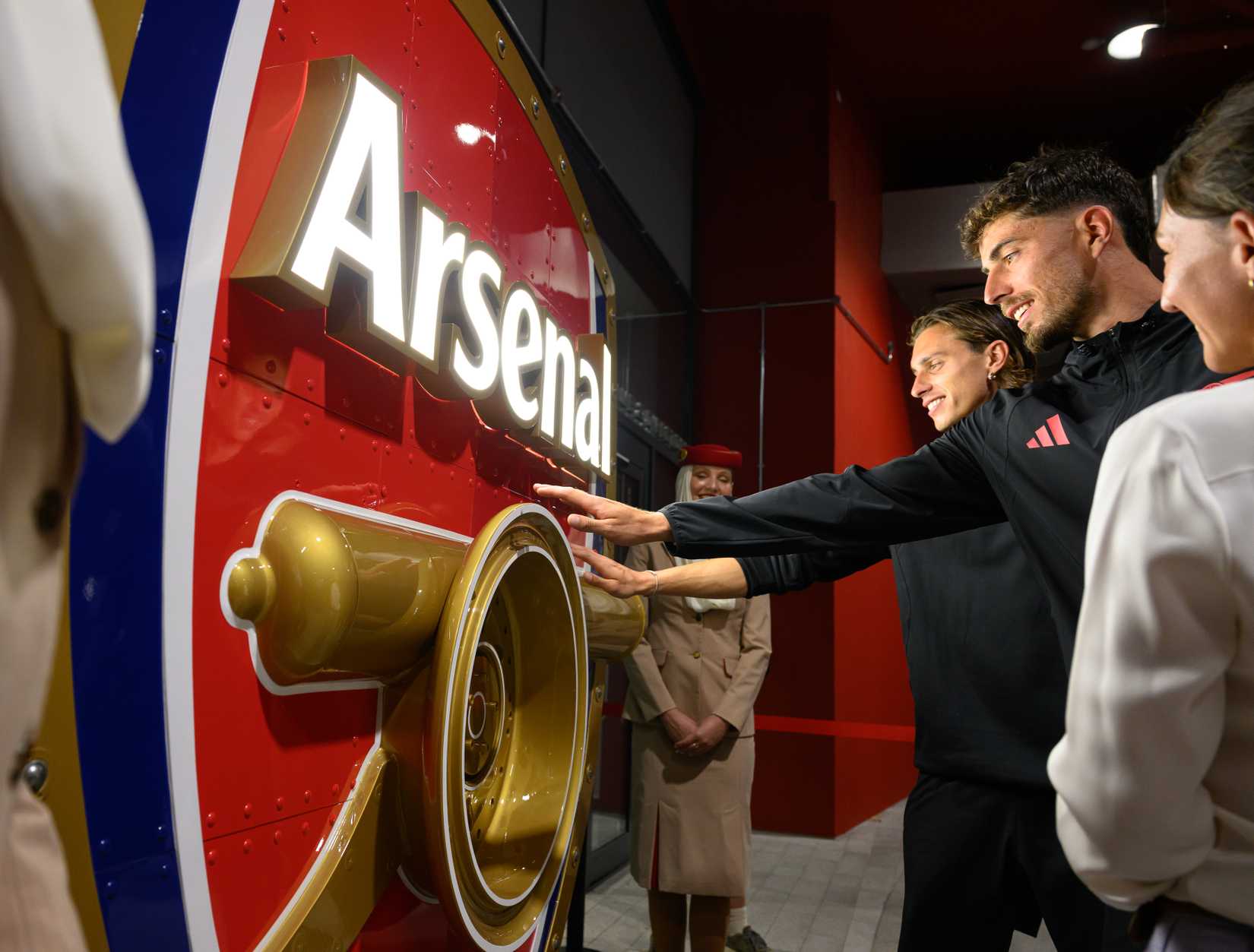 Arsenal Players Touching Upcycled Emirates Badge