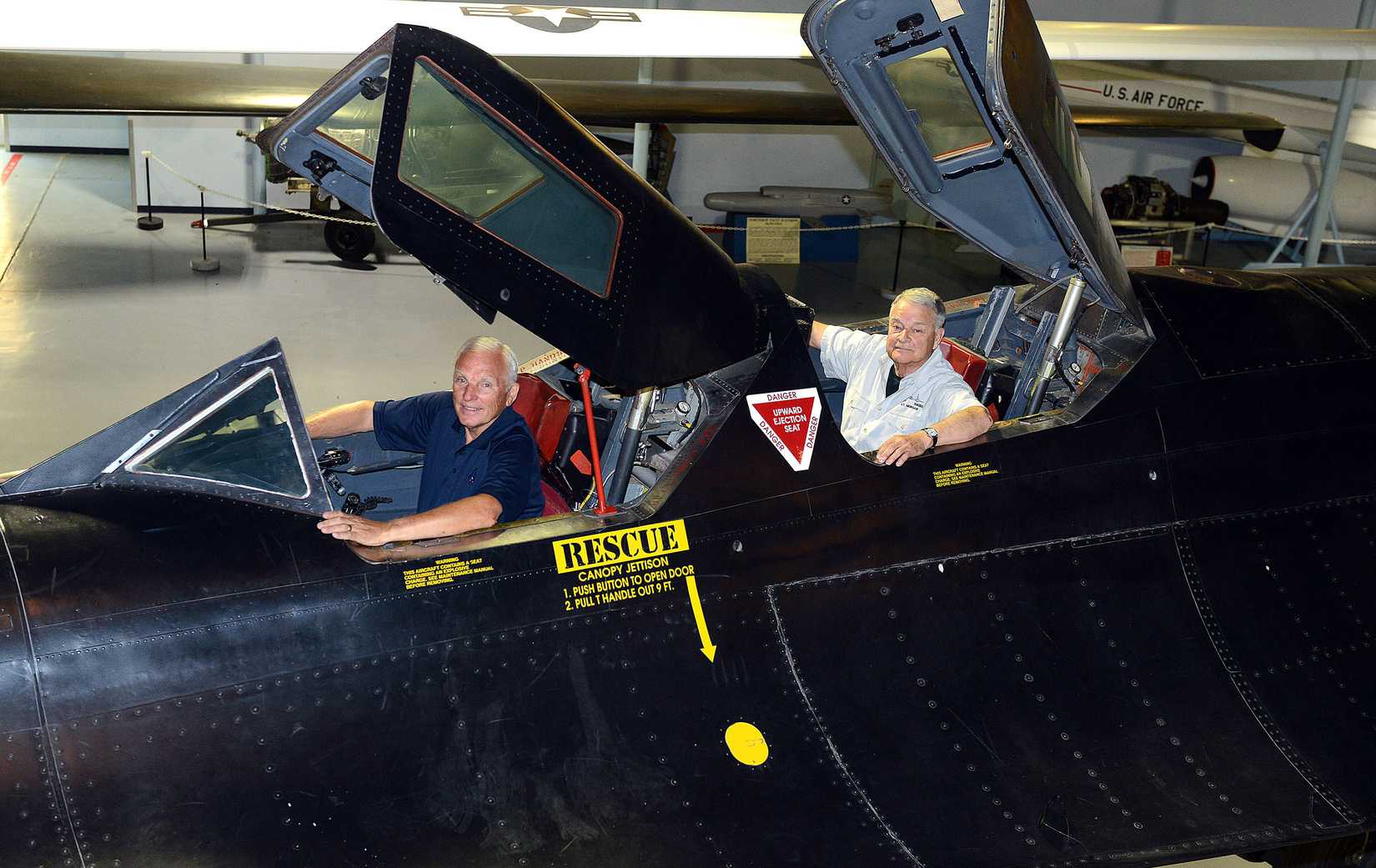 Maj. Gen. Eldon “Al” Joersz, USAF pilot retired, front, and Lt. Col. George “GT” Morgan, USAF retired reconnaissance systems officer, sit inside the cockpit of the SR-71 aircraft they flew