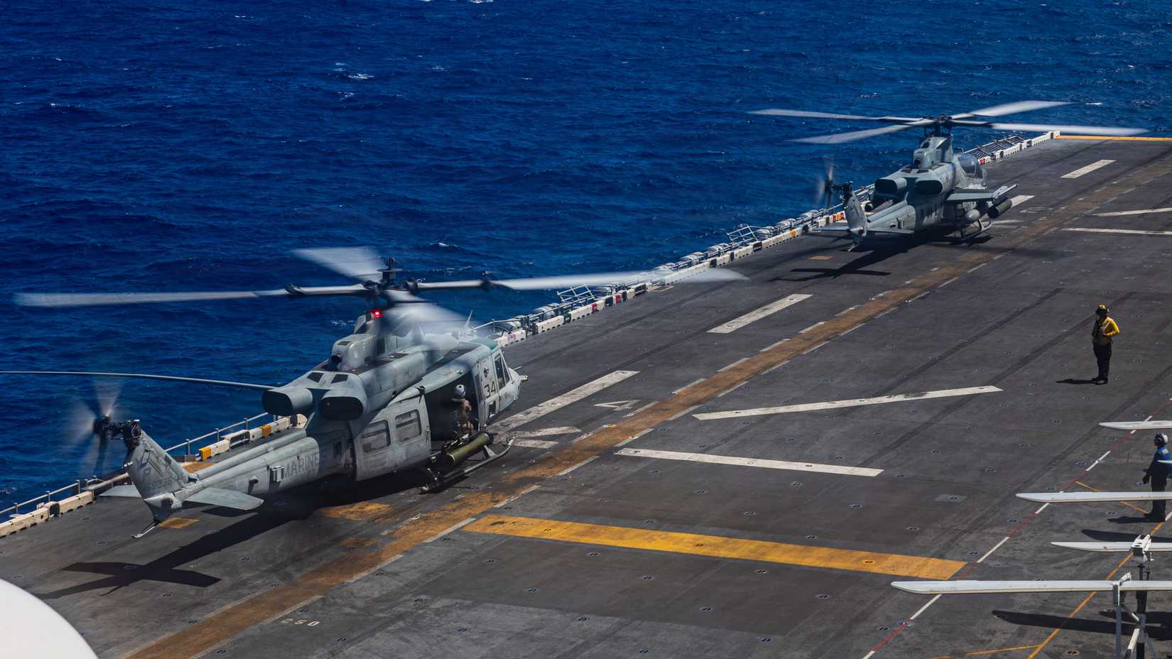 Marine Corps UH-1Y Venom and an AH-1Z Viper, both assigned to Marine Medium Tiltrotor Squadron (VMM) 163