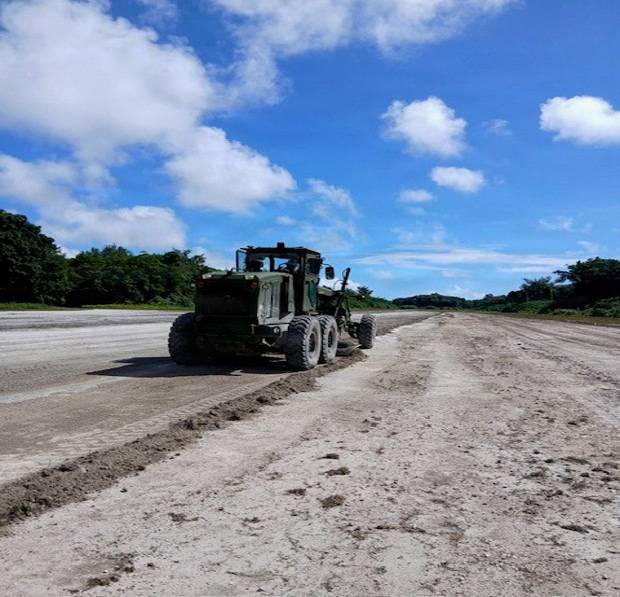 Marines with Marine Corps Engineer Detachment Pacific 26.1 skillfully employ a grader to rehabilitate Peleliu Airfield