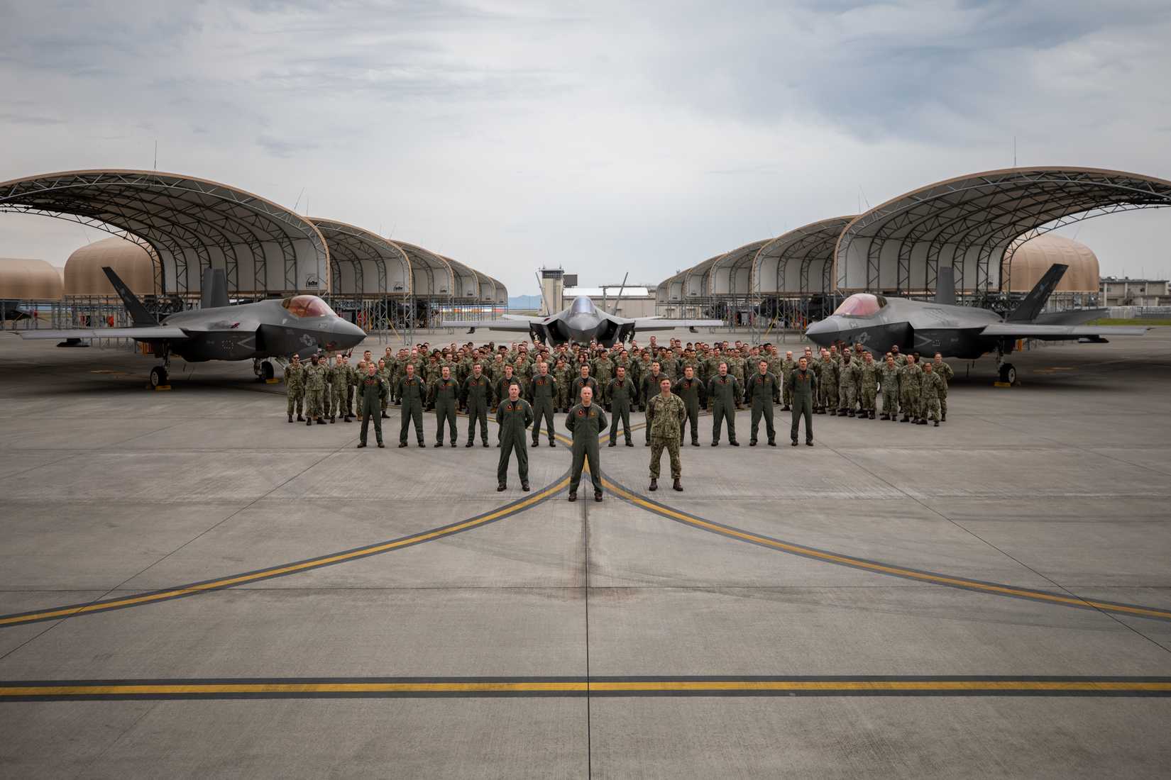 Navy Strike Fighter Squadron (VFA) 147, Carrier Air Wing (CVW) 5, poses for a group photo at Marine Corps Air Station Iwakuni, Japan