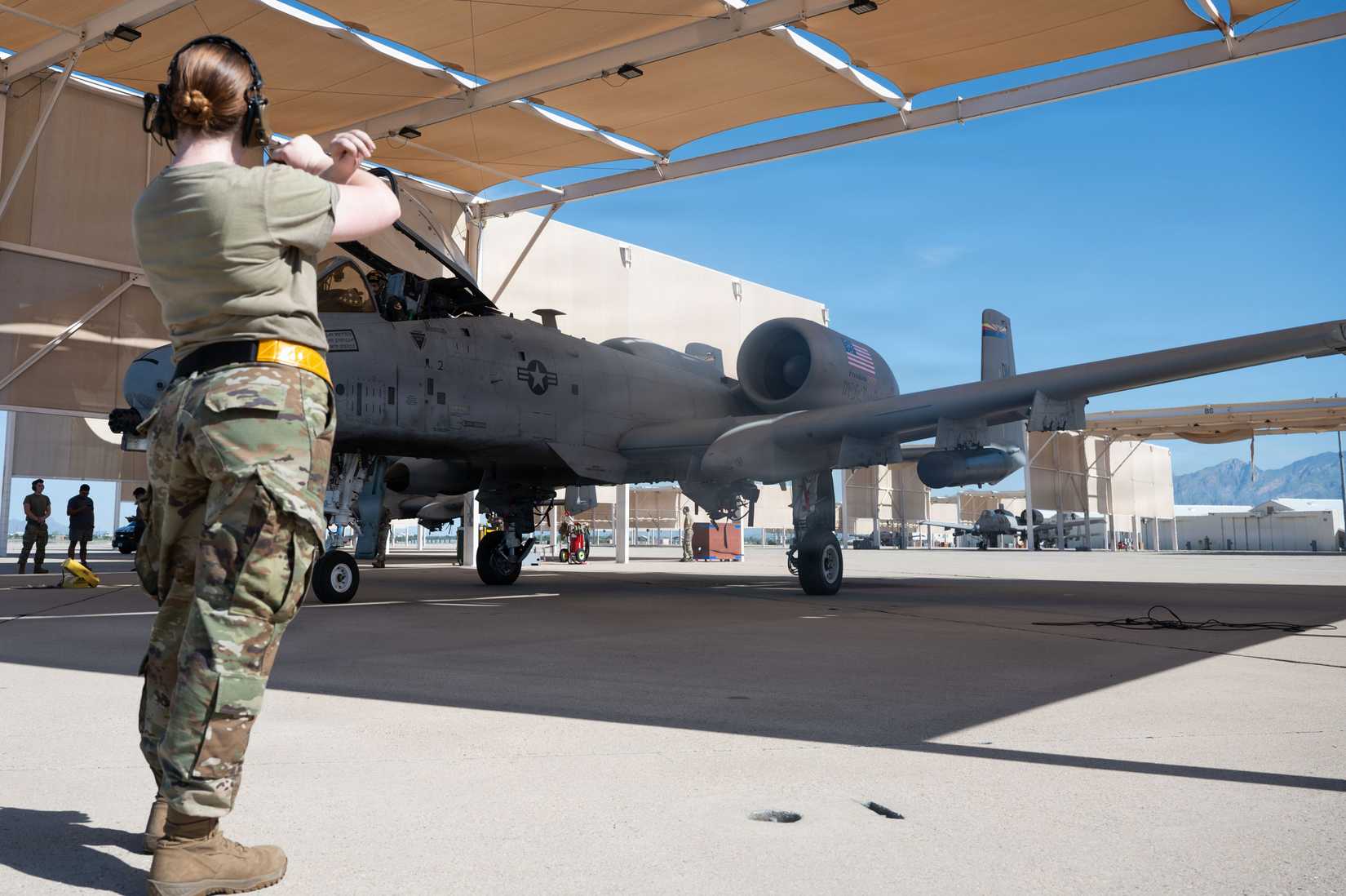 Second Lt. Madison Soboslai, 337th Air Control Squadron undergraduate battle manager, marshals an A-10C Thunderbolt II before its final flight
