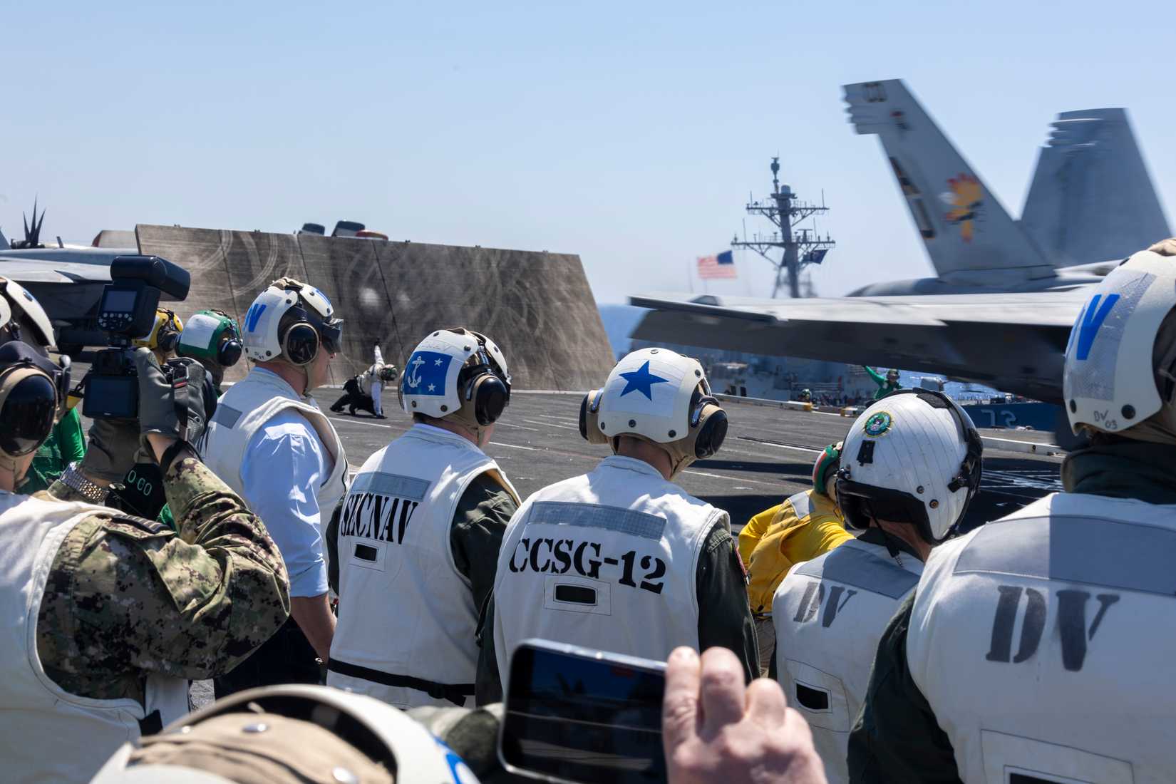 Secretary of the Navy, the Hon. John C. Phelan, observes an aircraft launch from the LSO platform aboard the world’s largest aircraft carrier, USS Gerald R. Ford (CVN 78)
