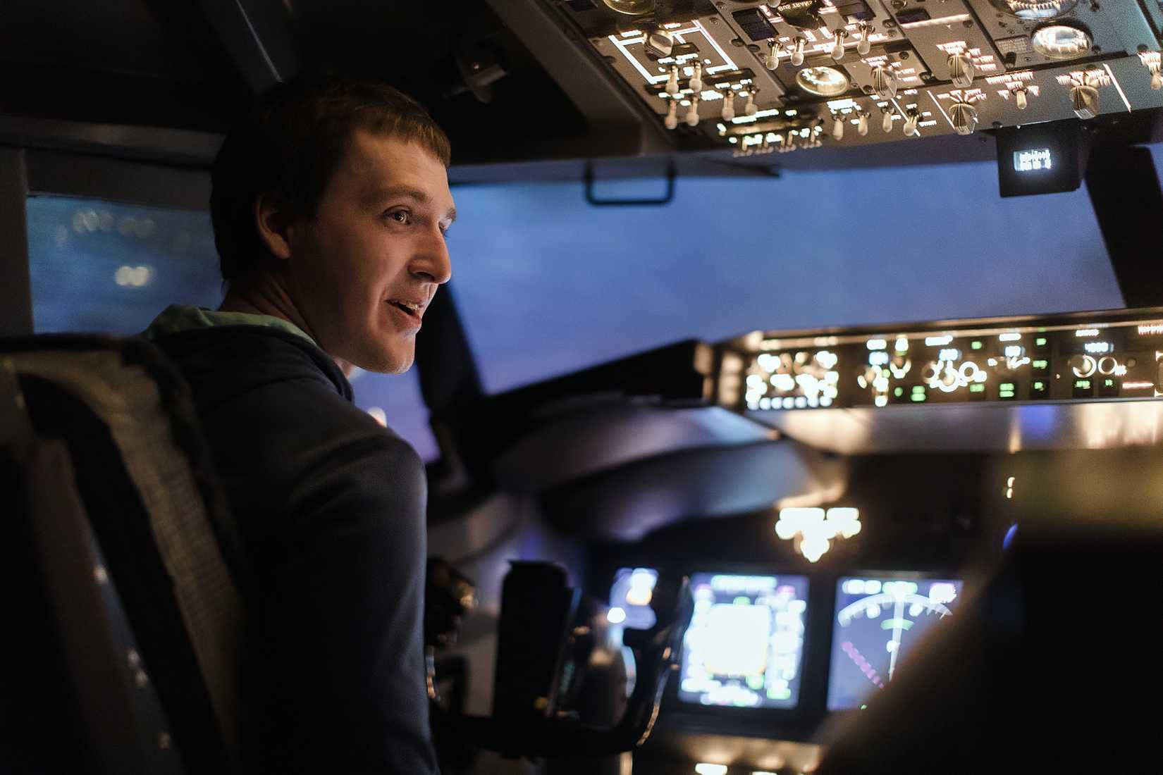 Young man in flight simulator 