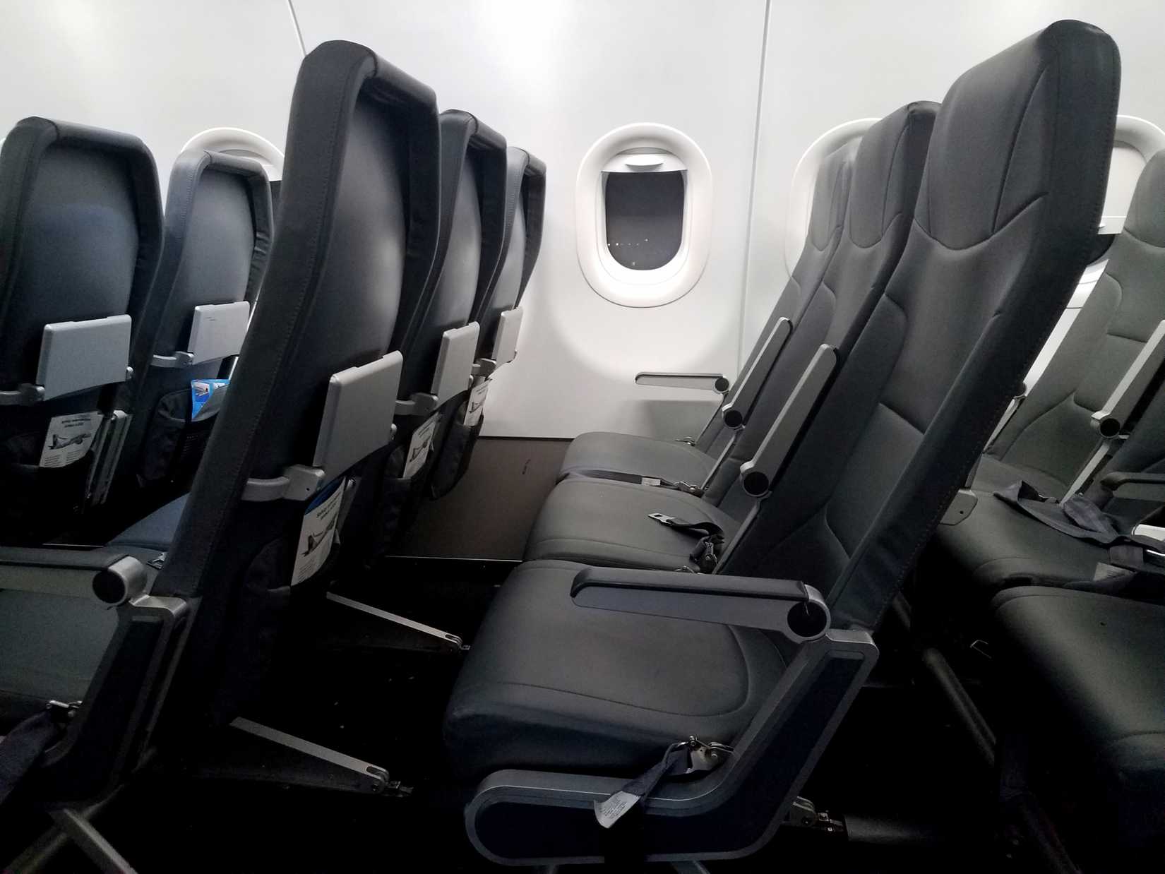 Fort Myers, Florida, U.S.A - December 2, 2018 - Passenger seats on the cheap flight of Frontier Airlines