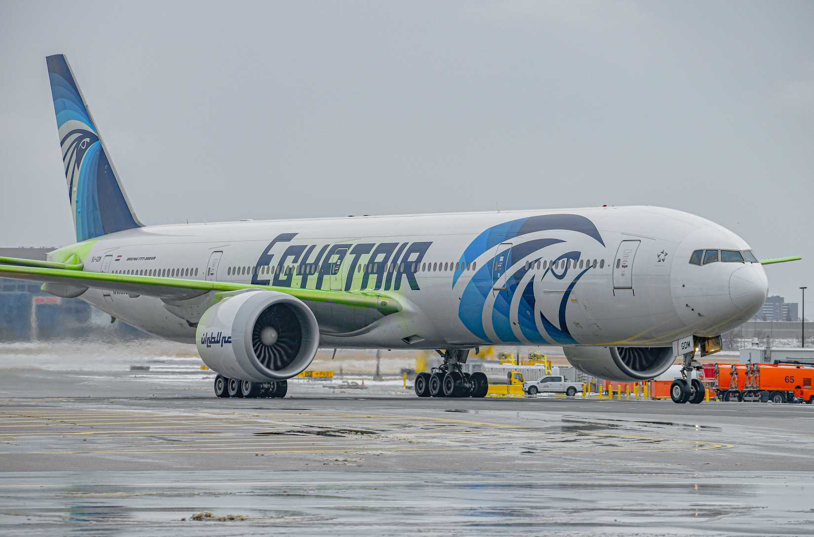 n Egyptair Boeing 777-300ER taxiing to the runway after being deiced. The green fluid is Type IV deice fluid, designed to prevent any snow or ice buildup.