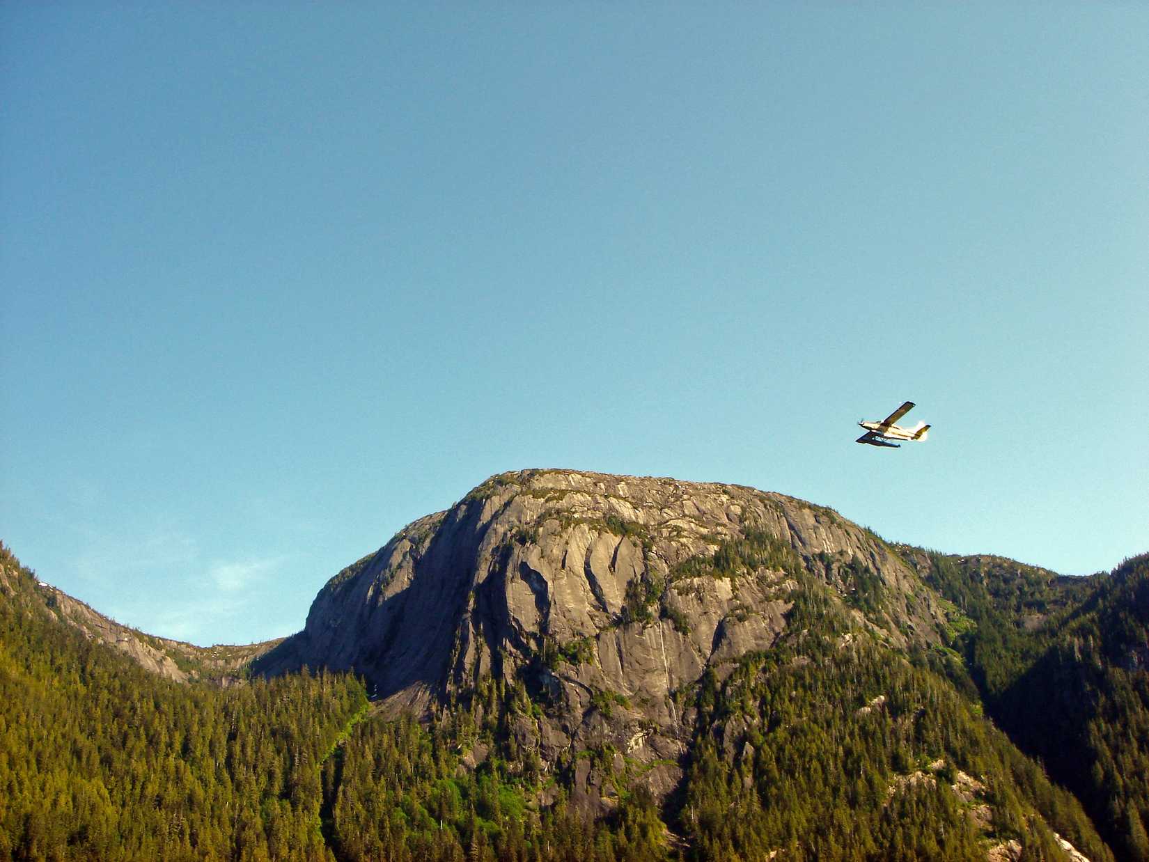Small plane flying over the mountains, Alaska