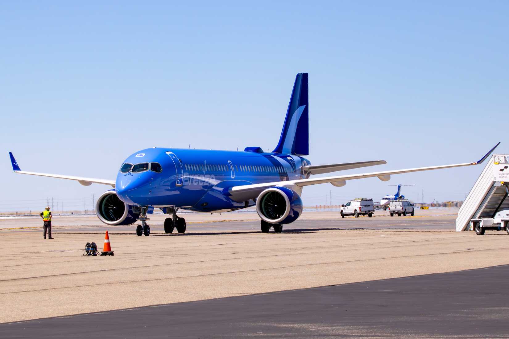 Breeze A220 Parked On Remote Stand