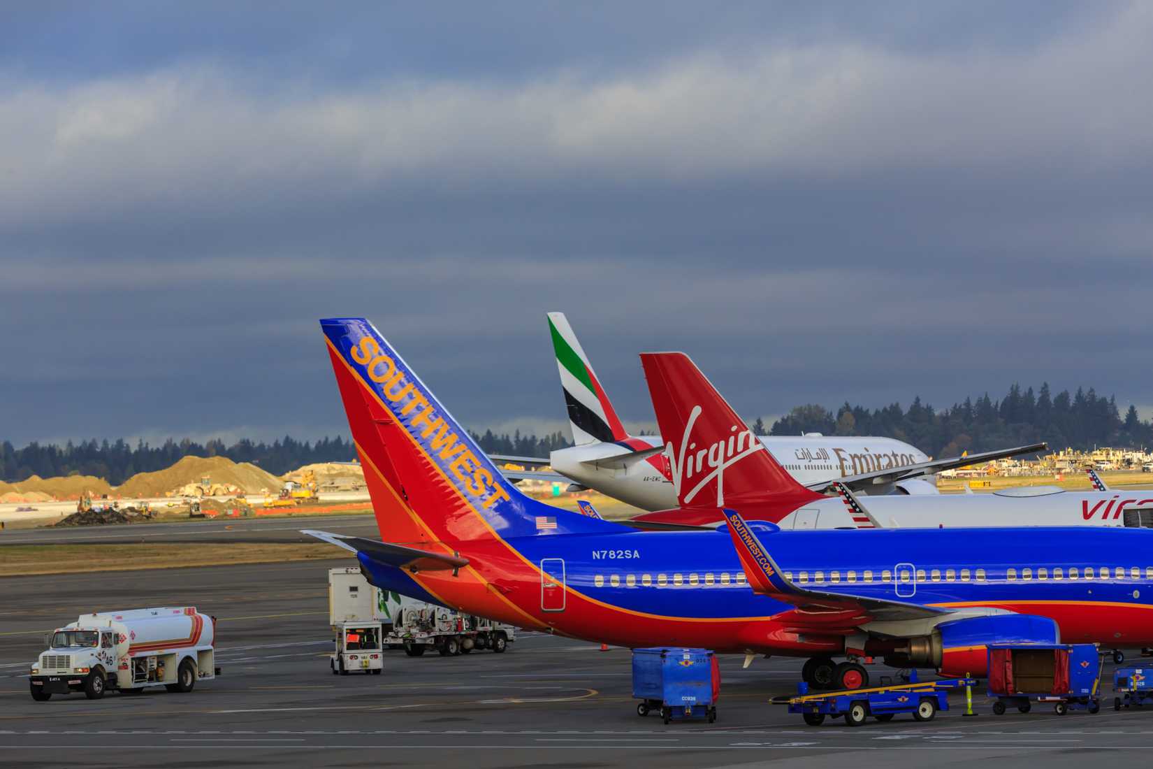 Southwest Airlines, Virgin, Emirates aircraft together on ramp in Seattle