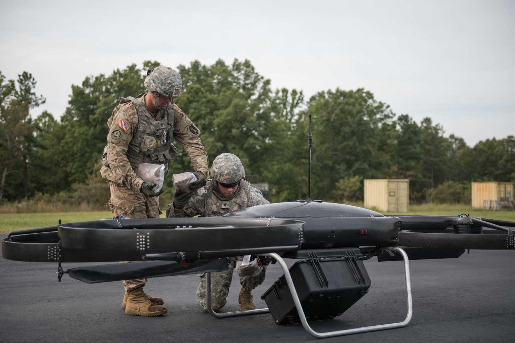 Soldiers of the 3d U.S. Infantry Regiment (The Old Guard) receive supplies from a Joint Tactical Aerial Resupply Vehicle (JTARV)