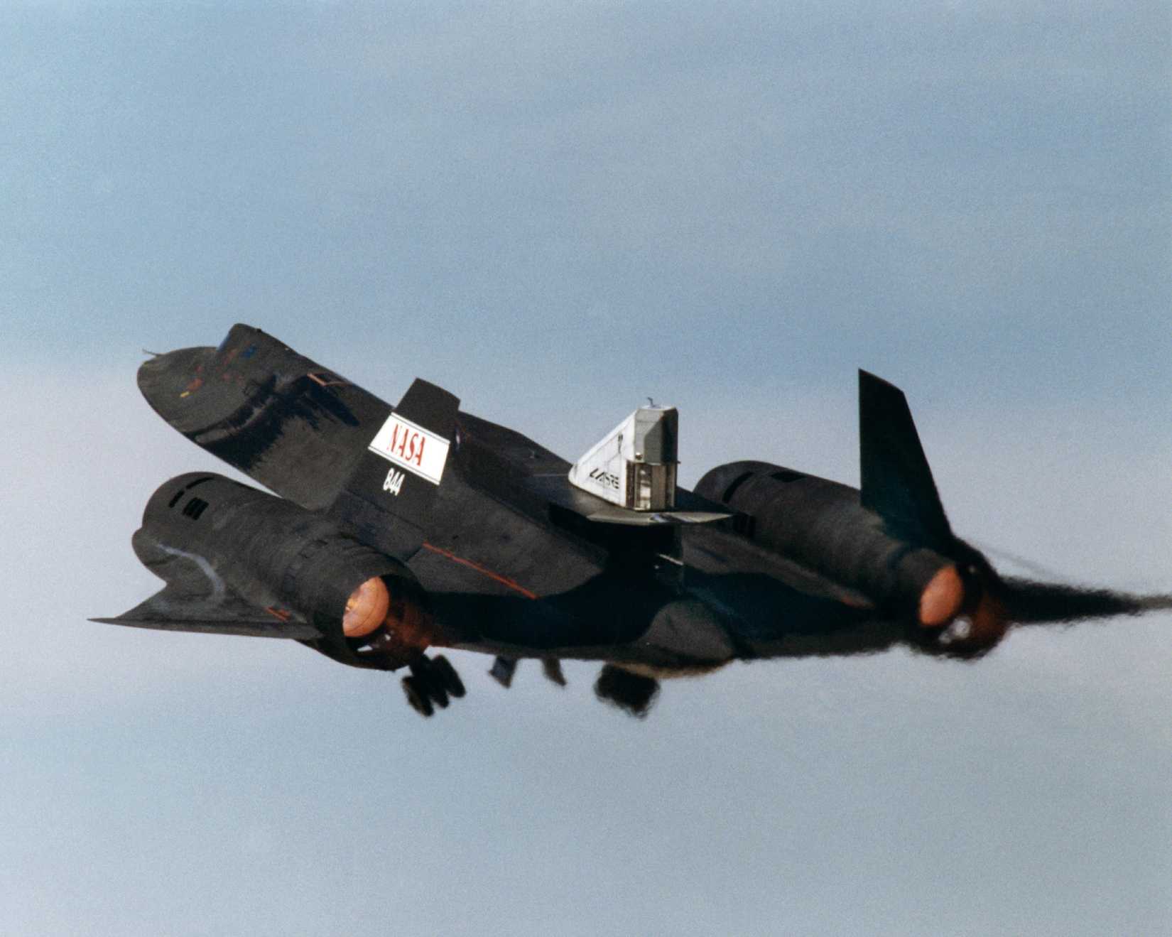 This photograph shows the LASRE pod on the upper rear fuselage of an SR-71 aircraft during take-off