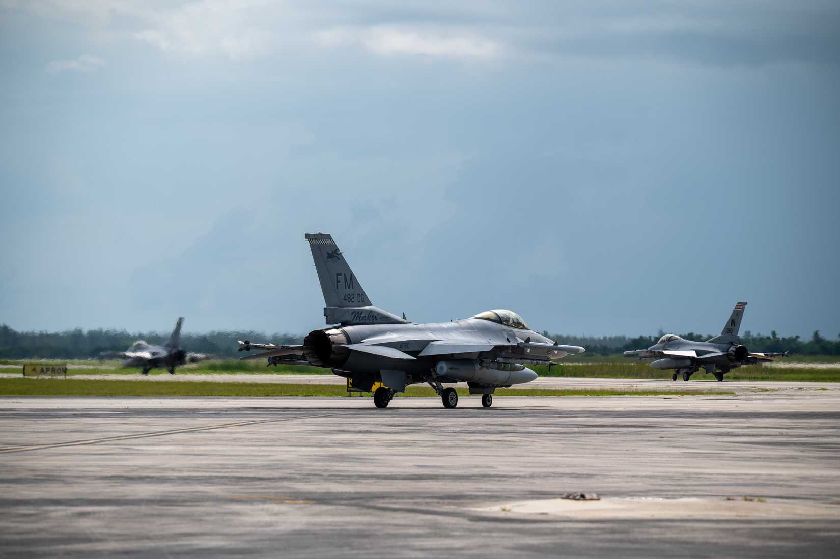 Three F-16 Fighting Falcons from the 93rd Fighter Squadron prepare for takeoff at Homestead Air Reserve Base