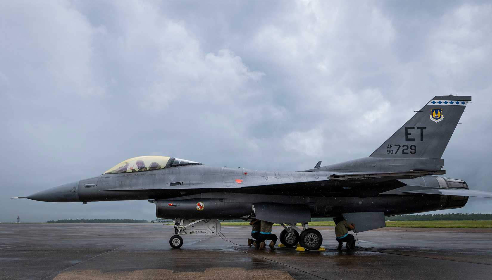 Tim Stevens, 40th Flight Test Squadron test pilot, gives the Shaka sign after completing a VENOM test flight