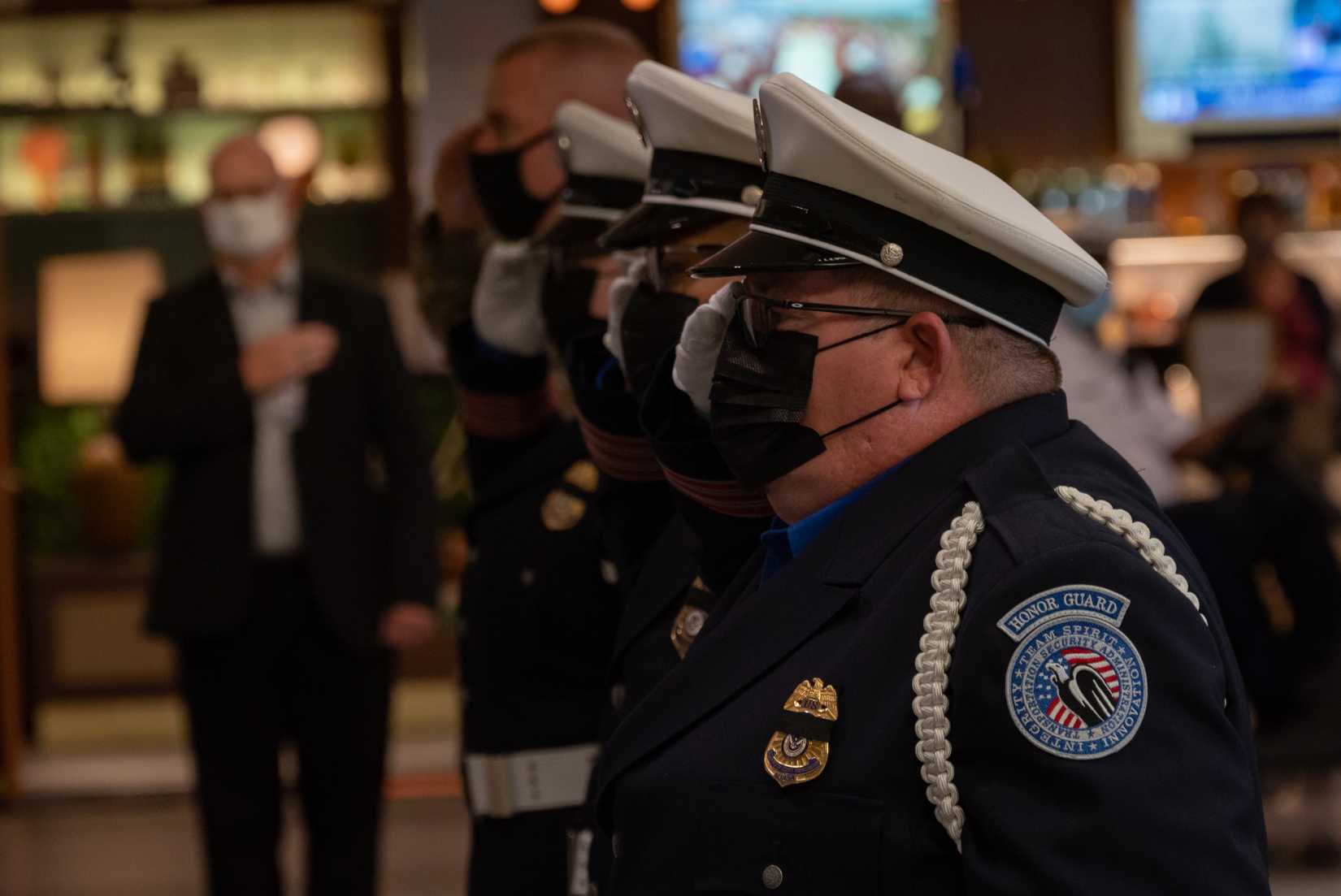 TSA Officers from the Philadelphia International Airport, Pennsylvania, participate in a commemorative march throughout the airport terminals September 11, 2021