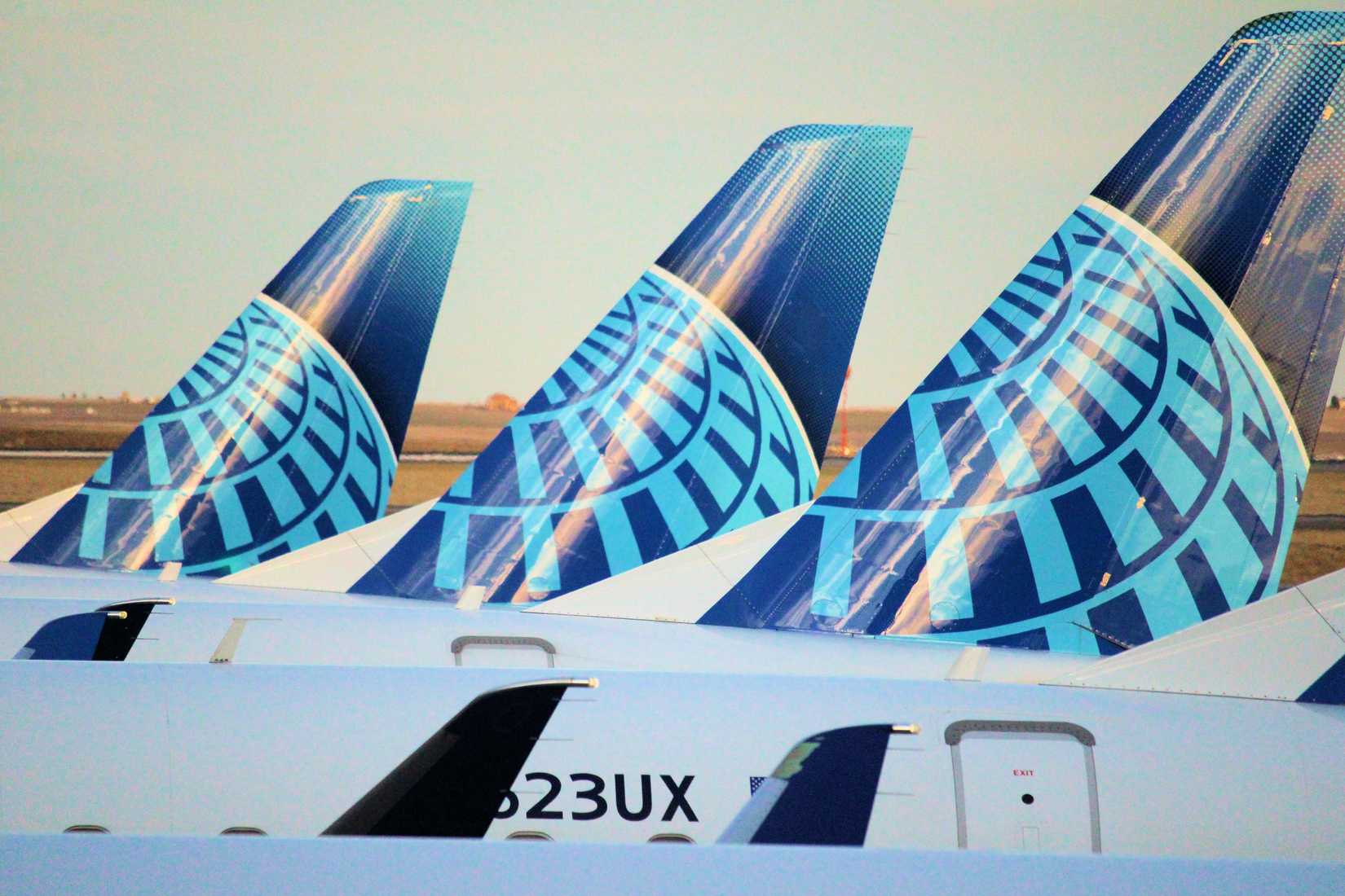 United Airlines aircraft with the globe logo and livery on gates at the B Concourse in the Denver International Airport