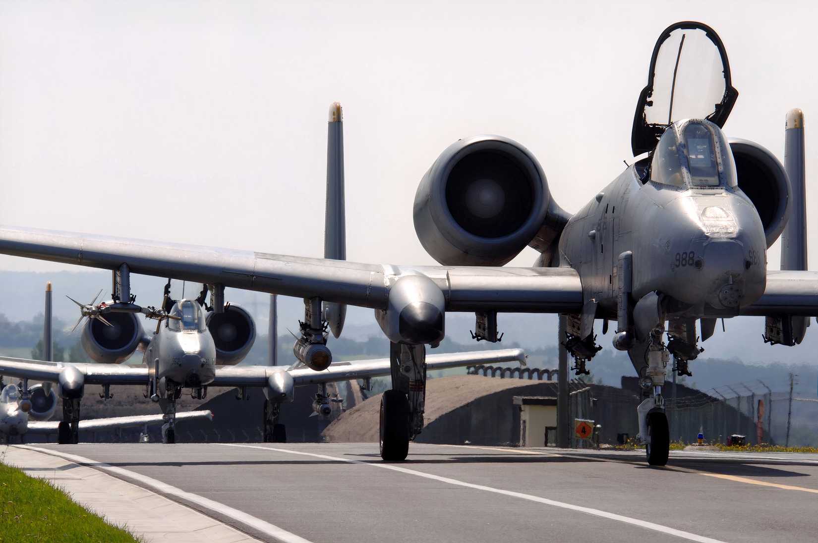 A photo of three A-10 Warthogs taxiing for takeoff.