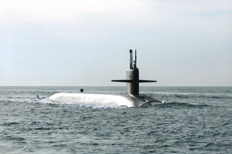 A photo of the surfaced ballistic missile submarine, USS Wyoming, at sea.