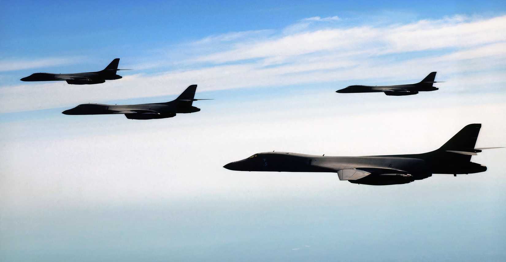 A photo showing a group of B-1s flying on a mission against a background of a cloudy sky.