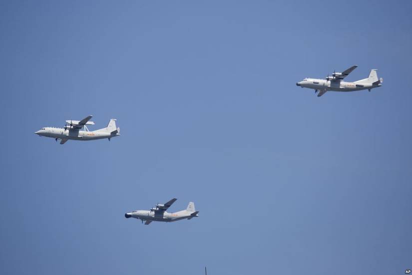 A KJ-200 airborne early warning and control plane, left, a Y-8J radar plane, center, and a Y-9JB radar plane, right, fly in formation during a parade commemorating the 70th anniversary of Japan's surrender during World War II in Beijing, Sept. 3, 2015.