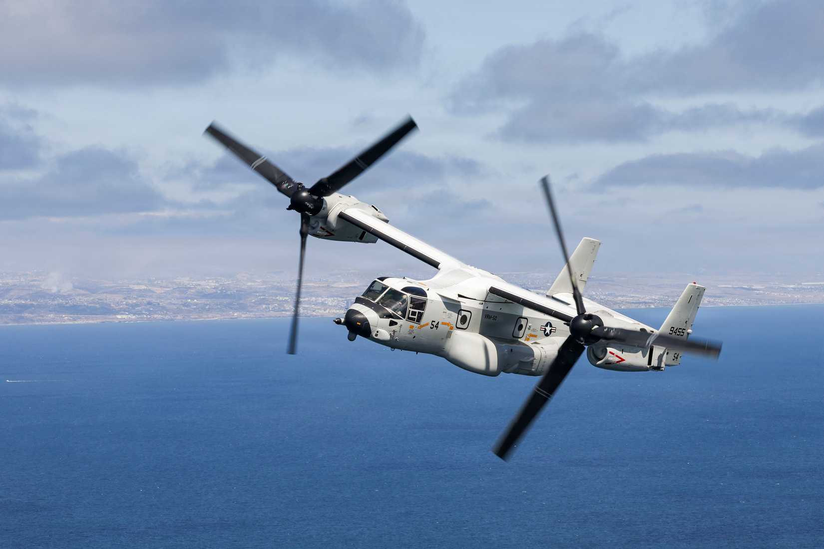 A CMV-22B Osprey tiltroter aircraft of Fleet Logistics Multi-Mission Squadron (VRM) 50 flies over the Pacific Ocean