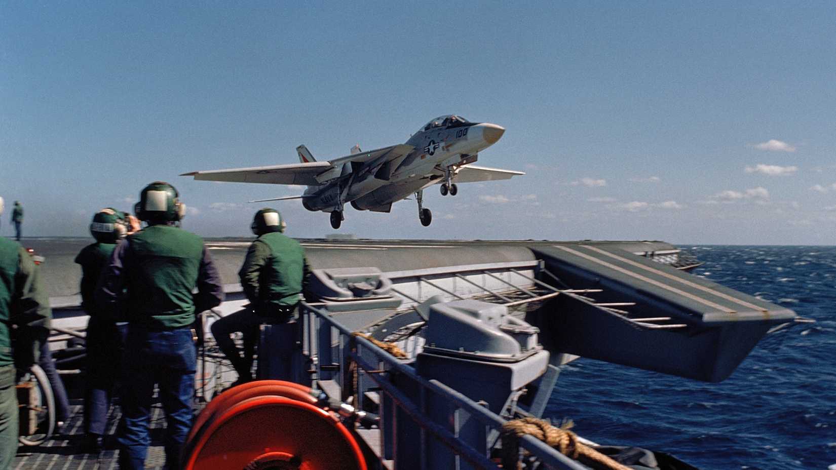 A Fighter Squadron 14 (VF-14) F-14 Tomcat aircraft clears the flight deck after a wave-off during flight operations aboard the aircraft carrier USS JOHN F. KENNEDY (CV 67)