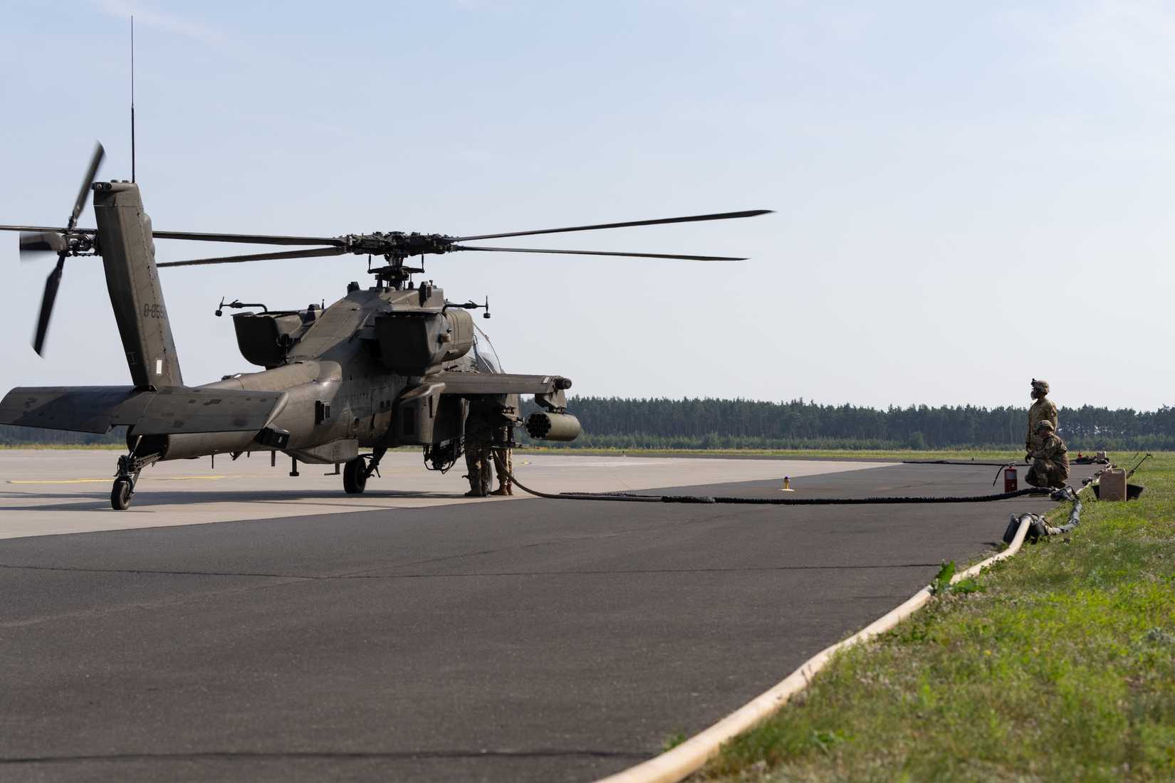 AH-64D Apache attack helicopter assigned to 1st Battalion, 501st Aviation Regiment, Combat Aviation Brigade, 1st Armored Division, during forward area refueling point operations at Forward Operating Site Powidz, Poland