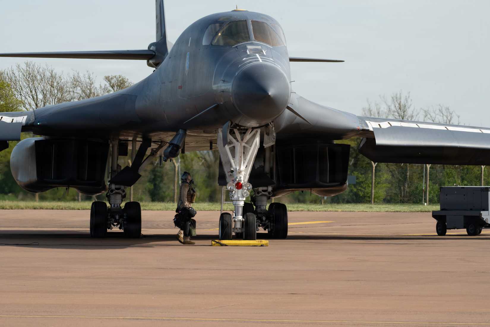 Air Force air crew member boards a B-1B Lancer