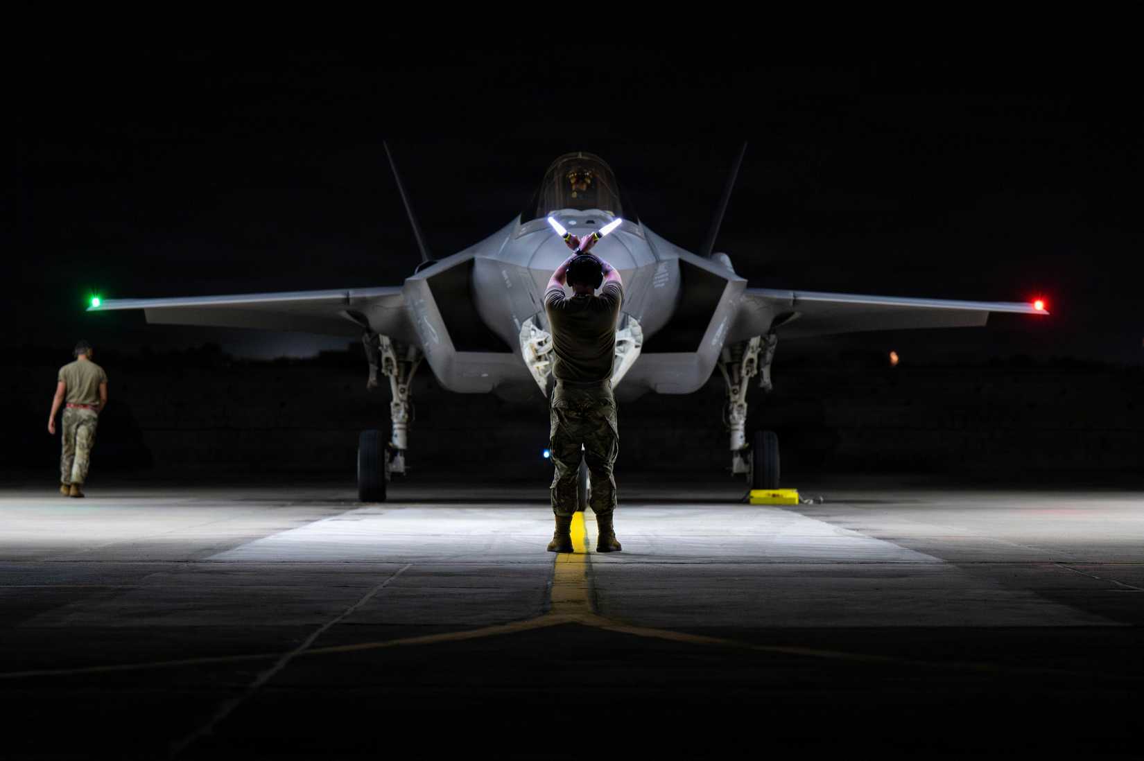 Air Force Airman assigned to the 13th Aircraft Maintenance Unit directs a U.S. Air Force F-35A Lightning II assigned to the 13th Fighter Squadron, Misawa Air Base, Japan