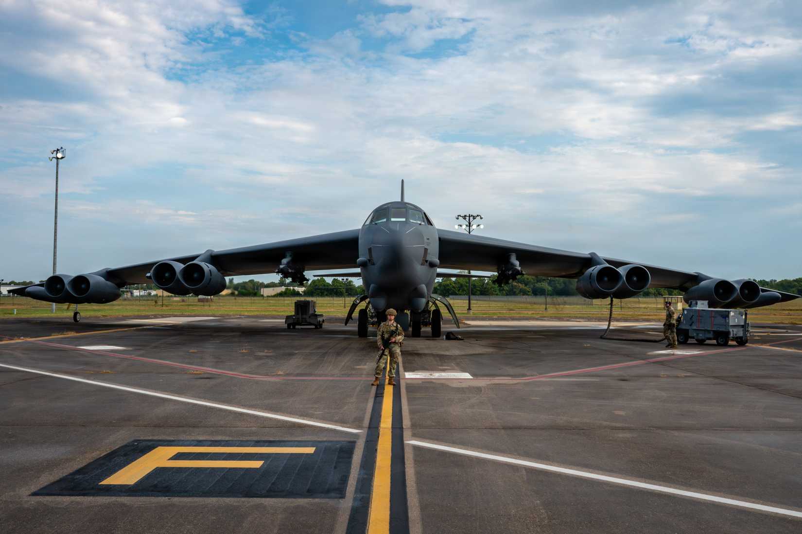 Air Force Airman Emma Garman, 2nd Security Forces Squadron response force member, secures a perimeter in front of a B-52H Stratofortress