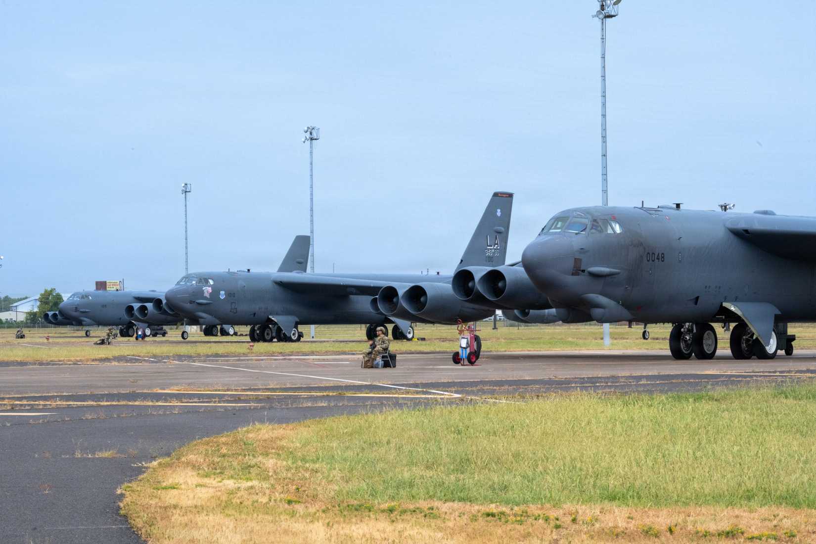 Air Force Airmen from the 2nd Security Forces Squadron provide security to three B-52H Stratofortress aircraft assigned to the 2nd Bomb Wing