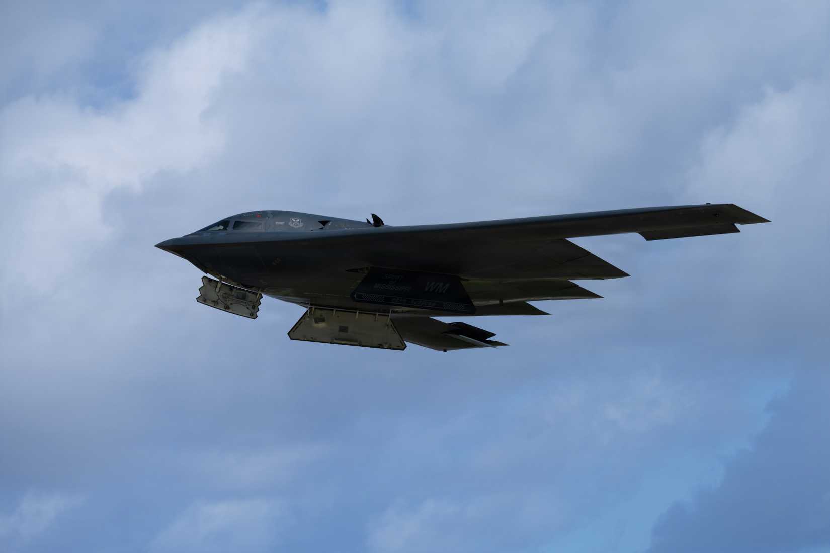 Air Force B-2 Spirit aircraft flies over Andersen Air Force Base, Guam