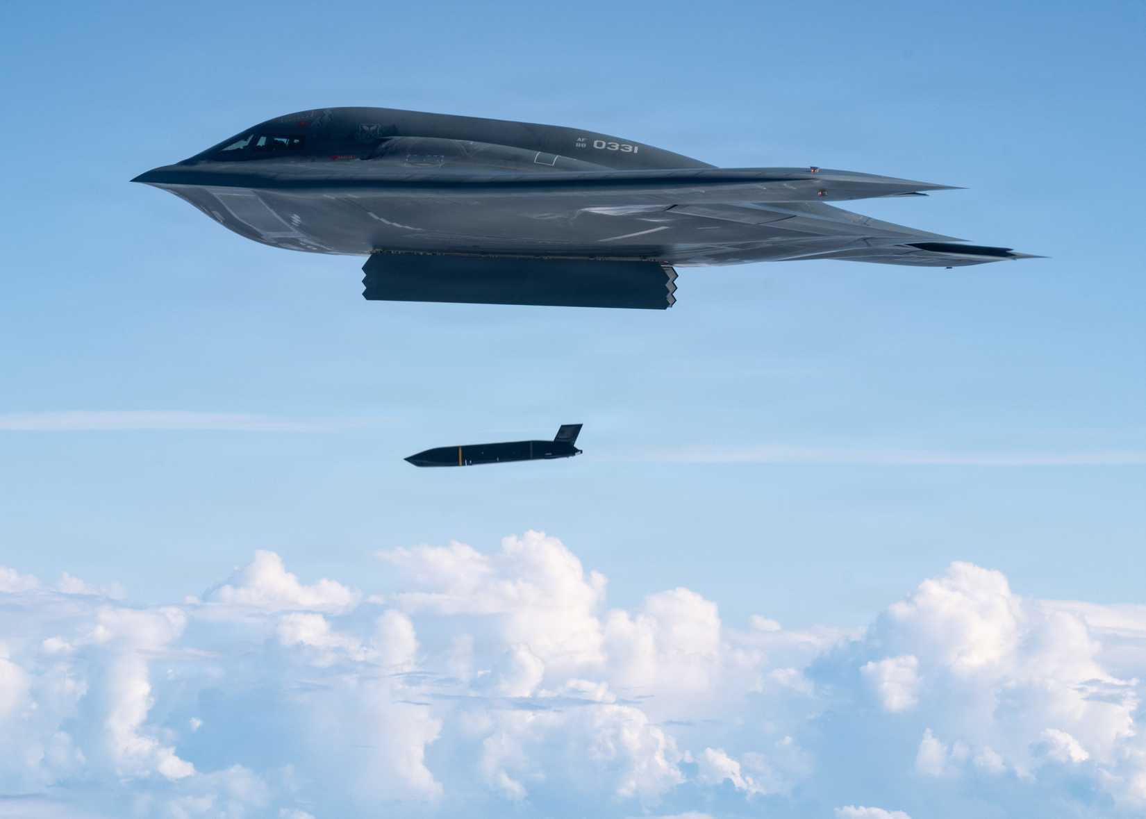 Air Force B-2 Spirit Stealth Bomber, assigned to the 509th Bomb Wing, deploys an AGM-158C Long Range Anti-Ship Missile