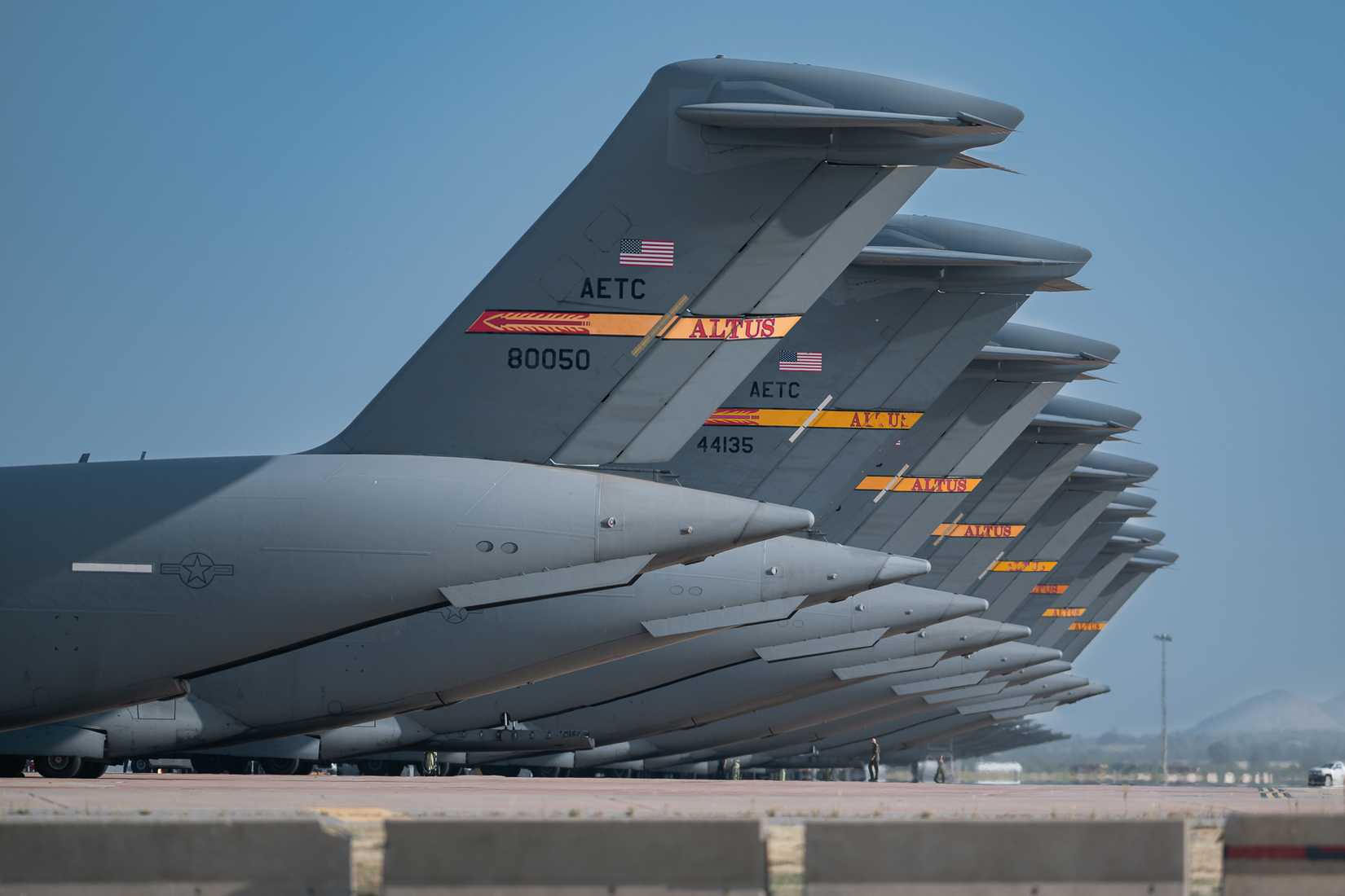 . Air Force C-17 Globemaster III aircraft are parked on the flightline at Altus Air Force Base