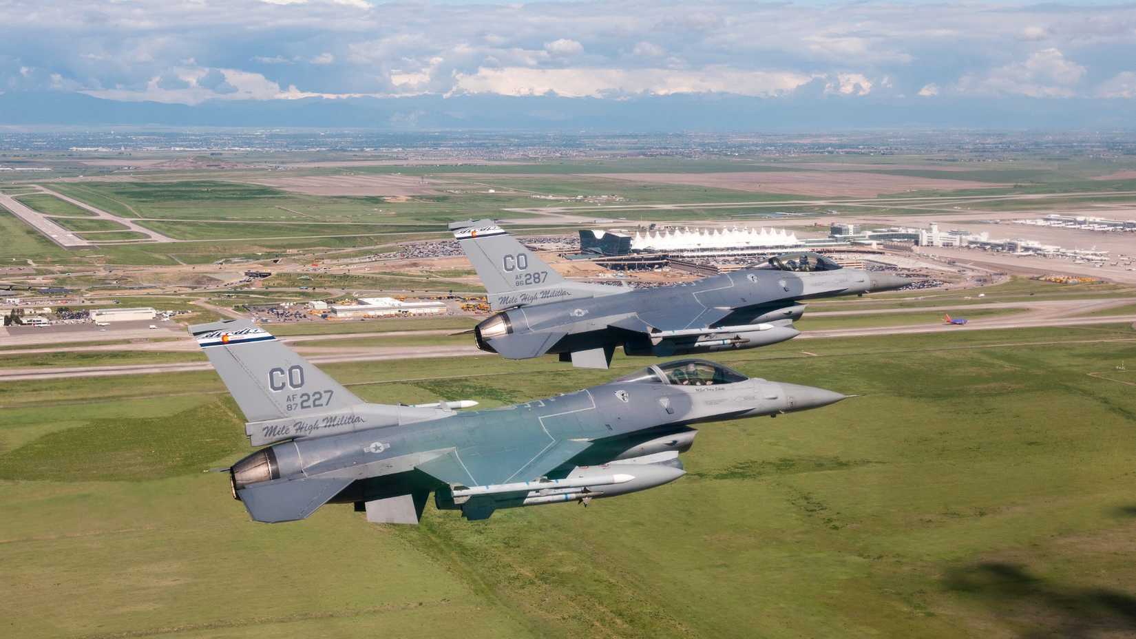 Air Force F-16 Fighting Falcons from the 120th Fighter Squadron, Colorado Air National Guard, fly past Denver International Airport