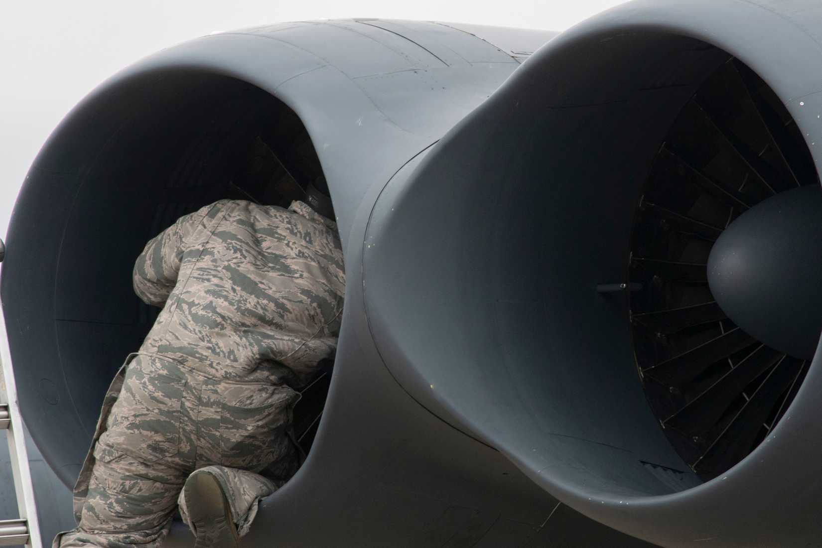 Airman assigned to the 307th Maintenance Squadron checks the engine of a B-52 Stratofortress at Barksdale Air Force Base